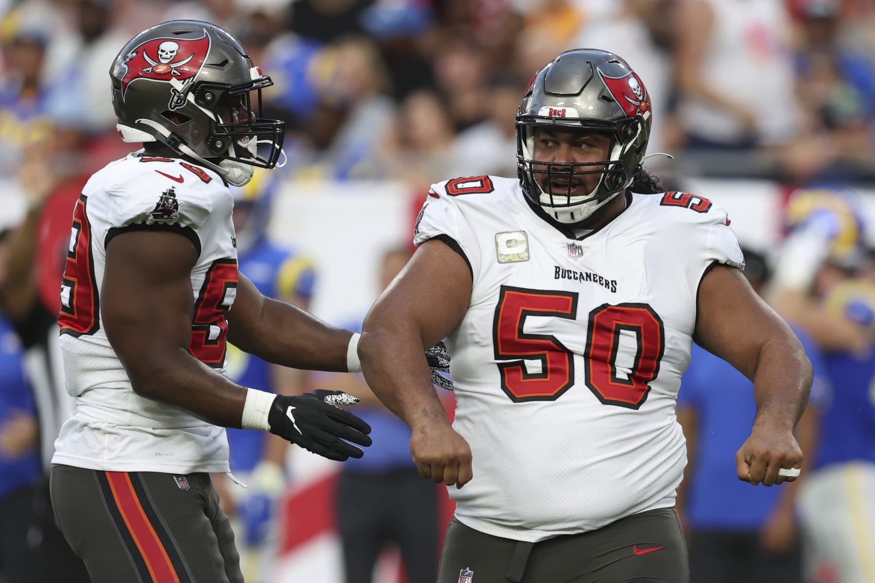 Tampa Bay Buccaneers defensive tackle Vita Vea (50) celebrates with teammate Justin Hollins after sacking Los Angeles Rams quarterback Matthew Stafford during the first half of an NFL football game between the Los Angeles Rams and Tampa Bay Buccaneers, Sunday, Nov. 6, 2022, in Tampa, Fla. (AP Photo/Mark LoMoglio)