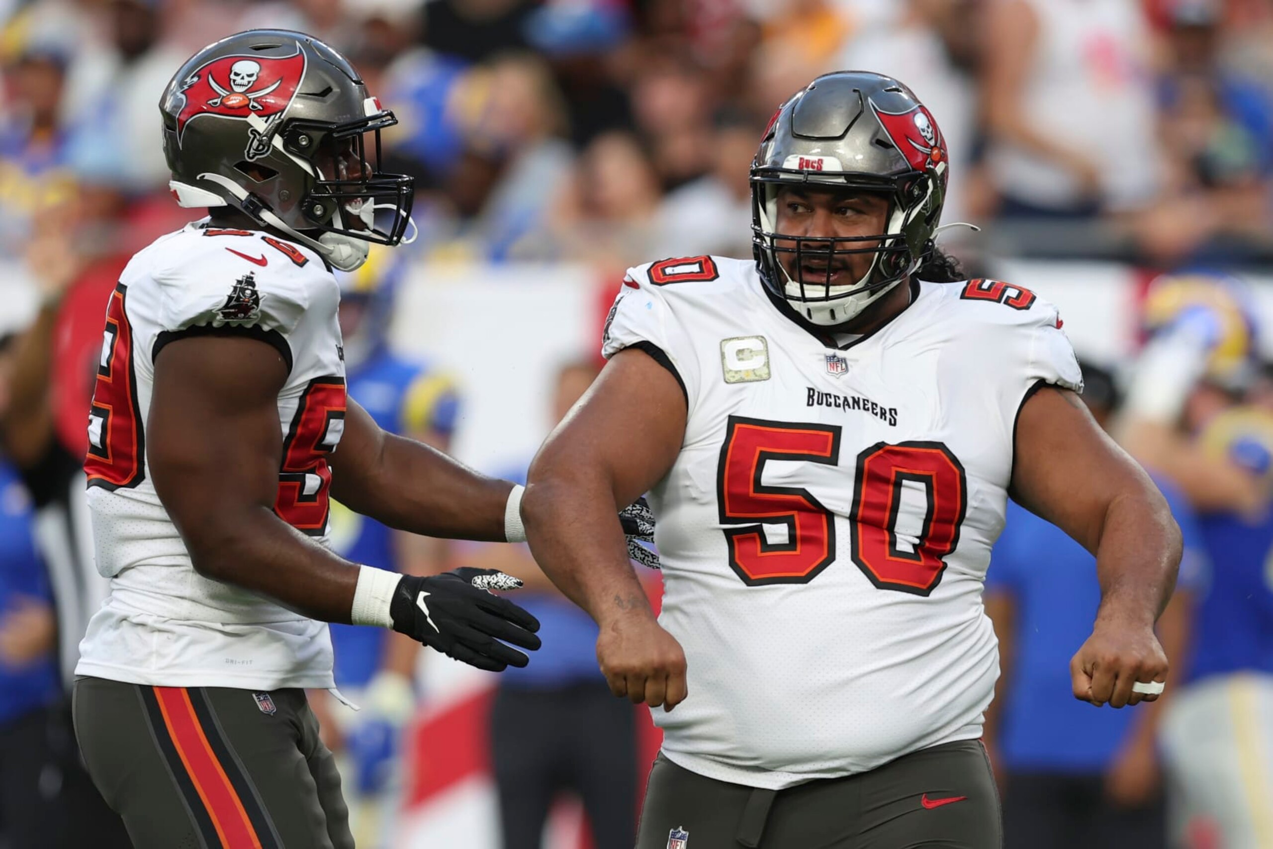 Tampa Bay Buccaneers defensive tackle Vita Vea (50) celebrates with teammate Justin Hollins after sacking Los Angeles Rams quarterback Matthew Stafford during the first half of an NFL football game between the Los Angeles Rams and Tampa Bay Buccaneers, Sunday, Nov. 6, 2022, in Tampa, Fla. (AP Photo/Mark LoMoglio) Tampa Bay Buccaneers defensive tackle Vita Vea (50) celebrates with teammate Justin Hollins after sacking Los Angeles Rams quarterback Matthew Stafford during the first half of an NFL football game between the Los Angeles Rams and Tampa Bay Buccaneers, Sunday, Nov. 6, 2022, in Tampa, Fla. (AP Photo/Mark LoMoglio)
