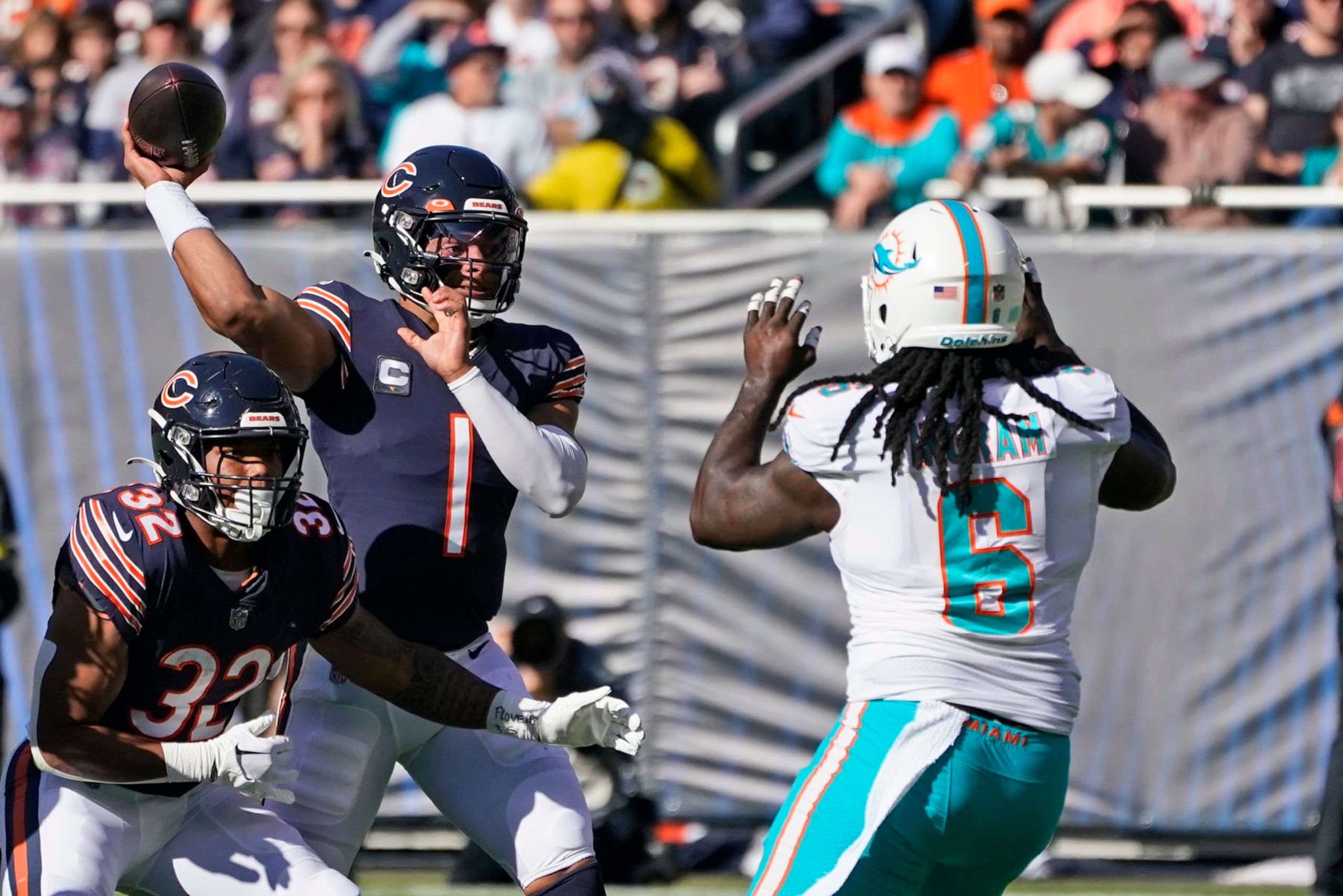 Justin Fields throws against Dolphins linebacker Melvin Ingram Justin Fields throws against Dolphins linebacker Melvin Ingram