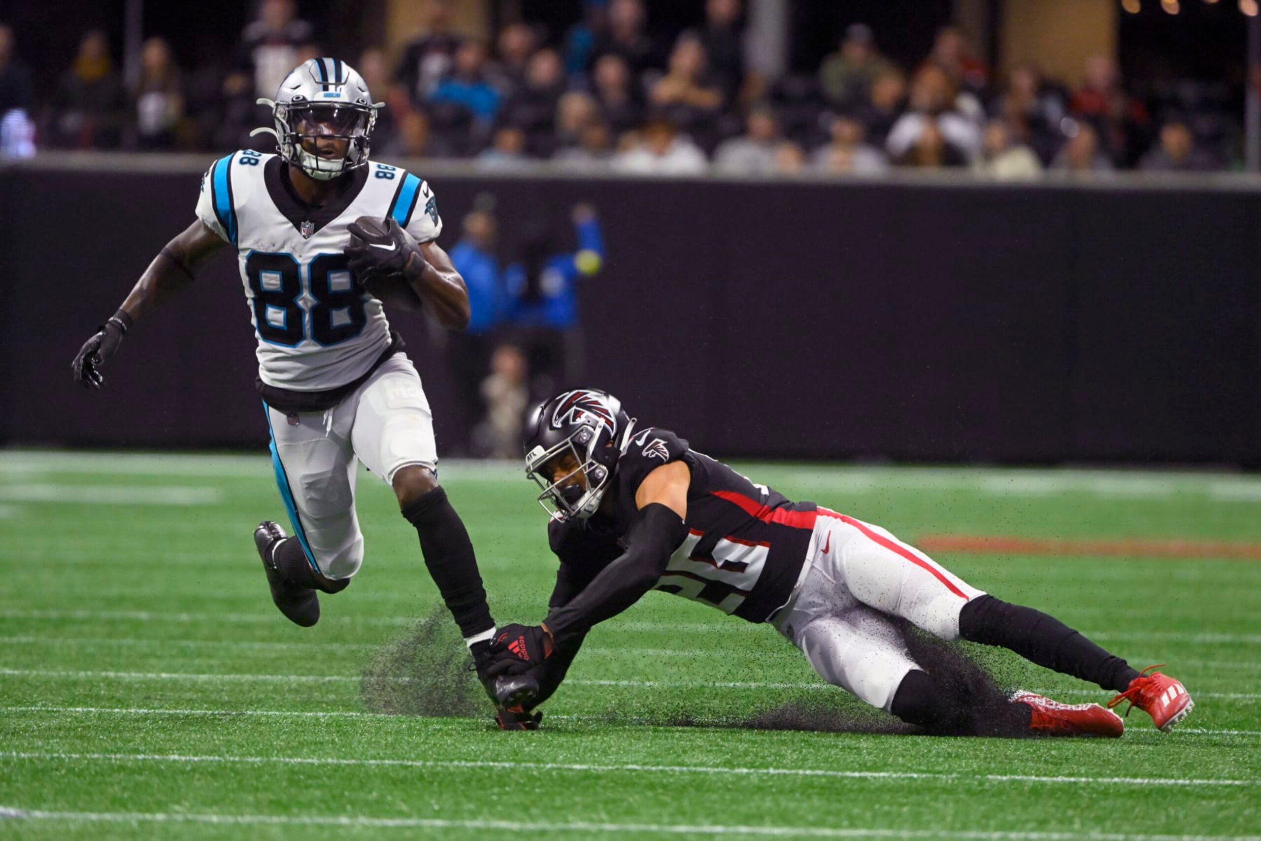 Carolina Panthers wide receiver Terrace Marshall Jr. (88) runs with the ball as Atlanta Falcons cornerback Isaiah Oliver (26) defends during the second half of an NFL football game Sunday, Oct. 30, 2022, in Atlanta. (AP Photo/John Amis) Carolina Panthers wide receiver Terrace Marshall Jr. (88) runs with the ball as Atlanta Falcons cornerback Isaiah Oliver (26) defends during the second half of an NFL football game Sunday, Oct. 30, 2022, in Atlanta. (AP Photo/John Amis)