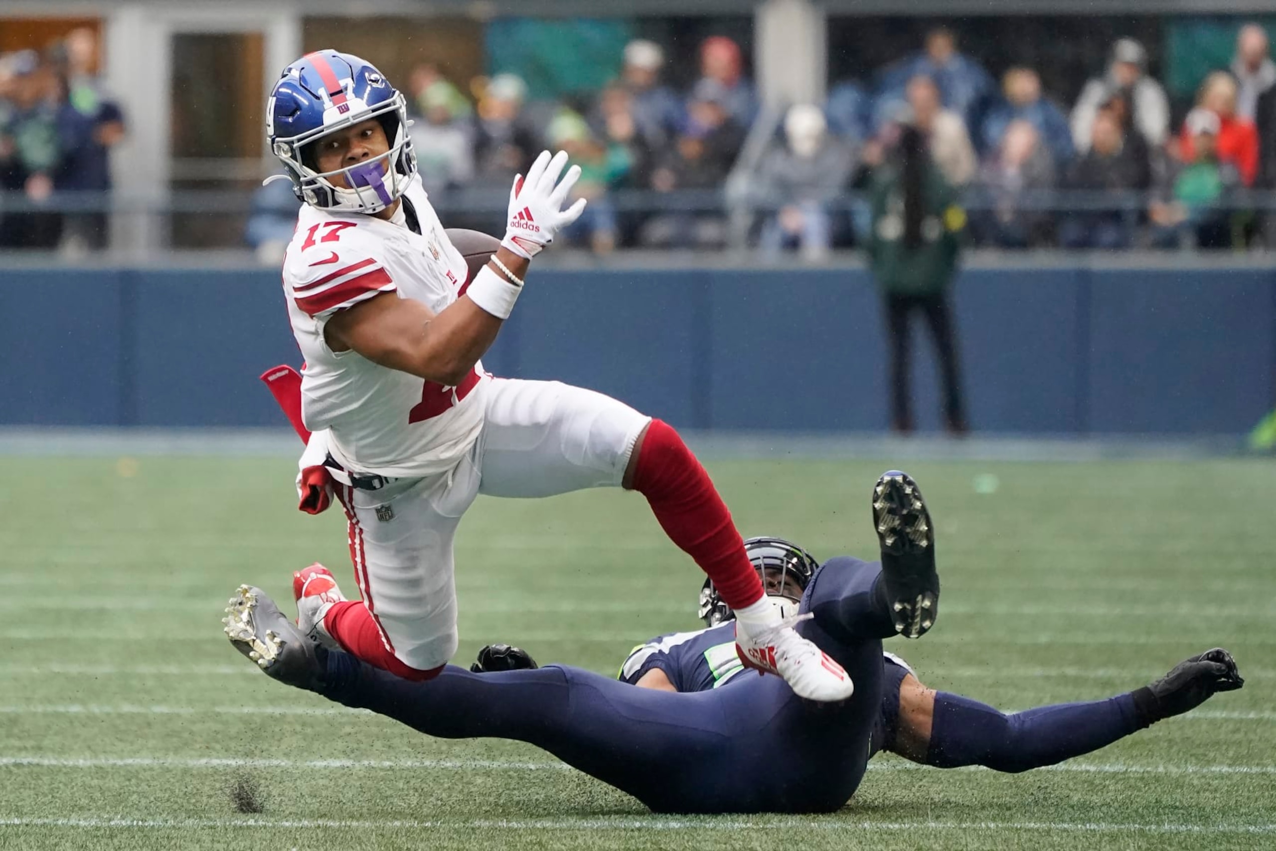New York Giants wide receiver Wan'Dale Robinson (17) runs against Seattle Seahawks linebacker Jordyn Brooks during the second half of an NFL football game in Seattle, Sunday, Oct. 30, 2022. (AP Photo/Marcio Jose Sanchez)
