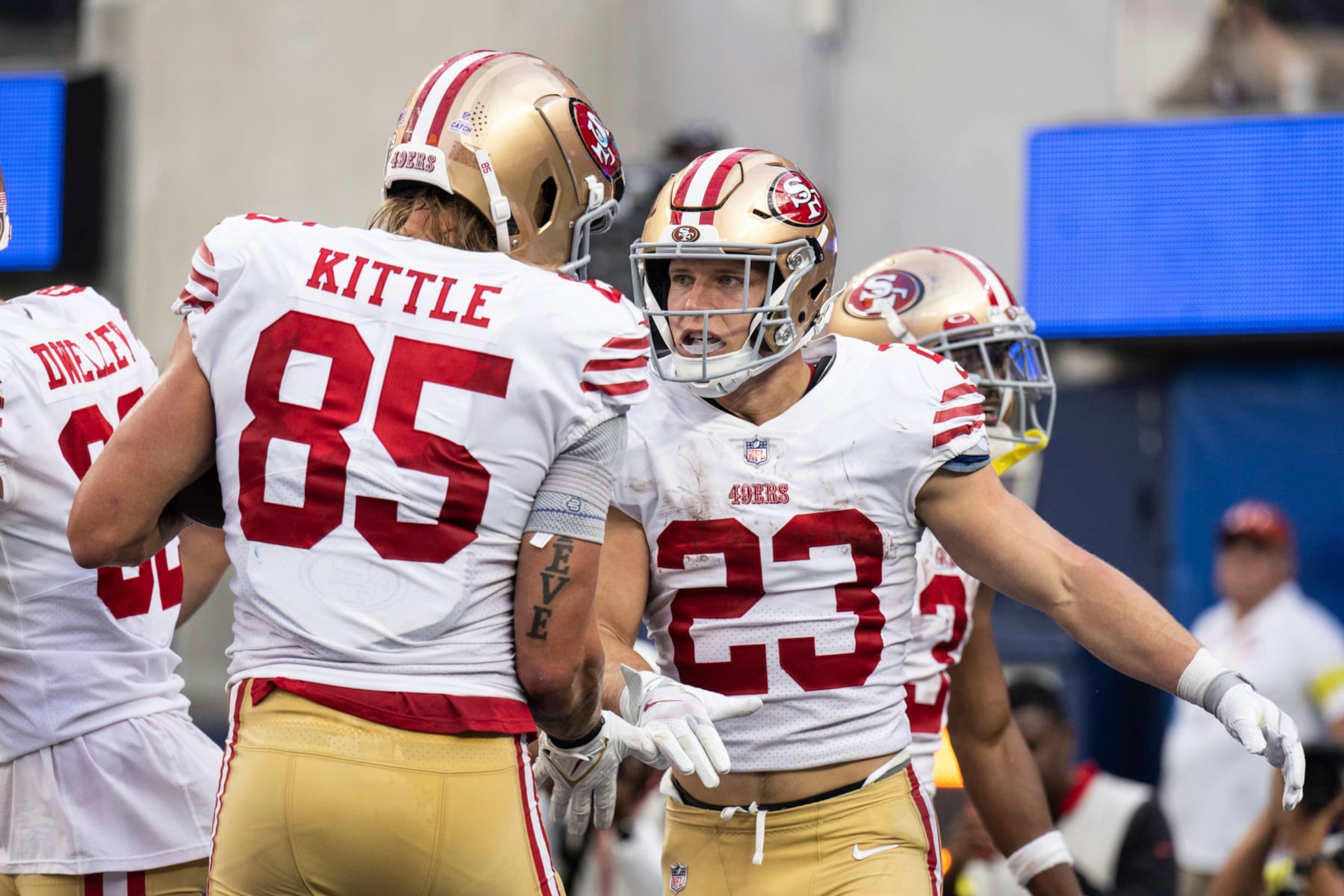 San Francisco 49ers running back Christian McCaffrey (23) and tight end George Kittle (85) celebrate McCaffrey's touchdown during an NFL football game against the Los Angeles Rams, Sunday, Oct. 30, 2022, in Inglewood, Calif. (AP Photo/Kyusung Gong)