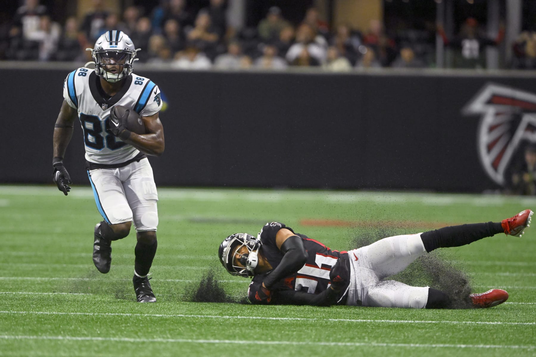 Carolina Panthers wide receiver Terrace Marshall Jr. (88) runs with the ball as Atlanta Falcons cornerback Isaiah Oliver (26) defends during the second half of an NFL football game Sunday, Oct. 30, 2022, in Atlanta. (AP Photo/John Amis)