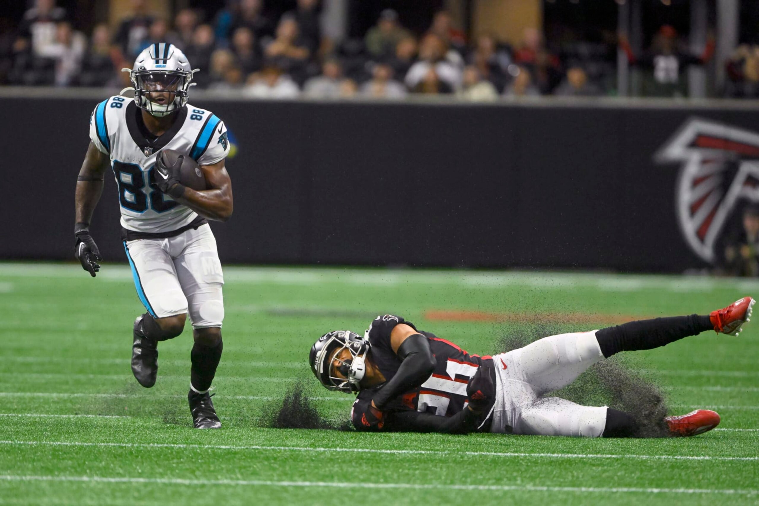 Carolina Panthers wide receiver Terrace Marshall Jr. (88) runs with the ball as Atlanta Falcons cornerback Isaiah Oliver (26) defends during the second half of an NFL football game Sunday, Oct. 30, 2022, in Atlanta. (AP Photo/John Amis)