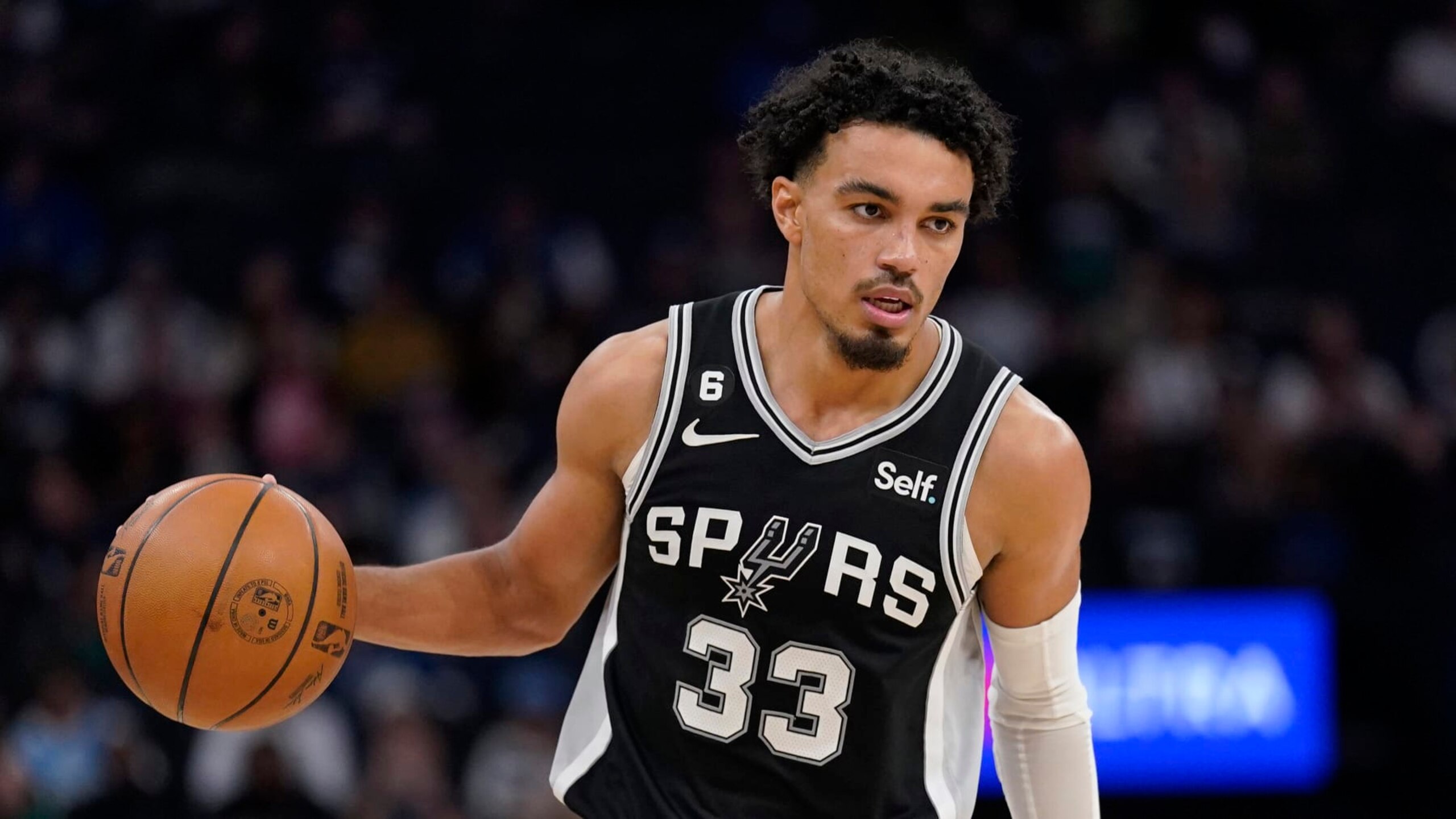 San Antonio Spurs guard Tre Jones (33) dribbles down the court during the second half of an NBA basketball game against the Minnesota Timberwolves, Monday, Oct. 24, 2022, in Minneapolis. (AP Photo/Abbie Parr) San Antonio Spurs guard Tre Jones (33) dribbles down the court during the second half of an NBA basketball game against the Minnesota Timberwolves, Monday, Oct. 24, 2022, in Minneapolis. (AP Photo/Abbie Parr)