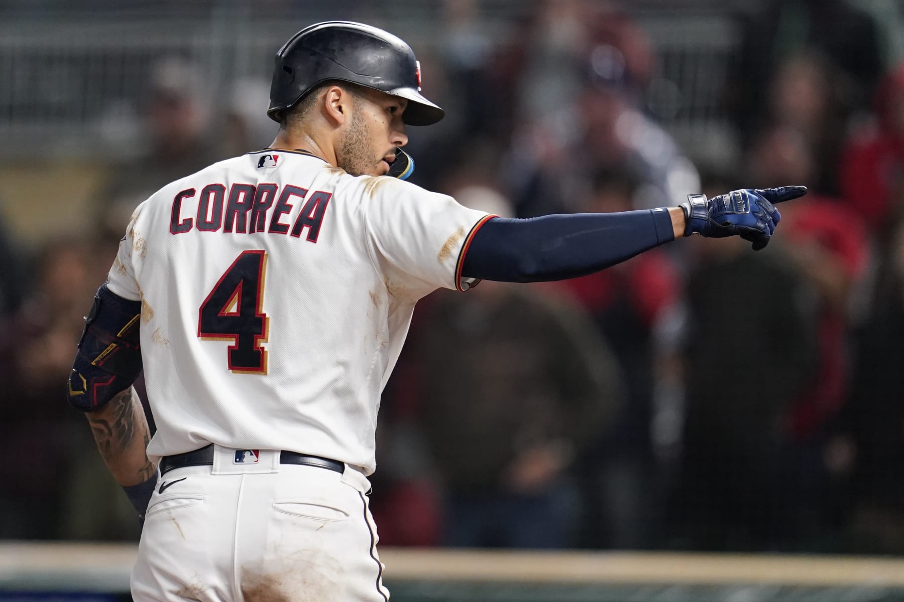 Minnesota Twins' Carlos Correa celebrates while crossing home plate after hitting a two-run home run during the eighth inning of the team's baseball game against the Cleveland Guardians, Friday, Sept. 9, 2022, in Minneapolis. (AP Photo/Abbie Parr)