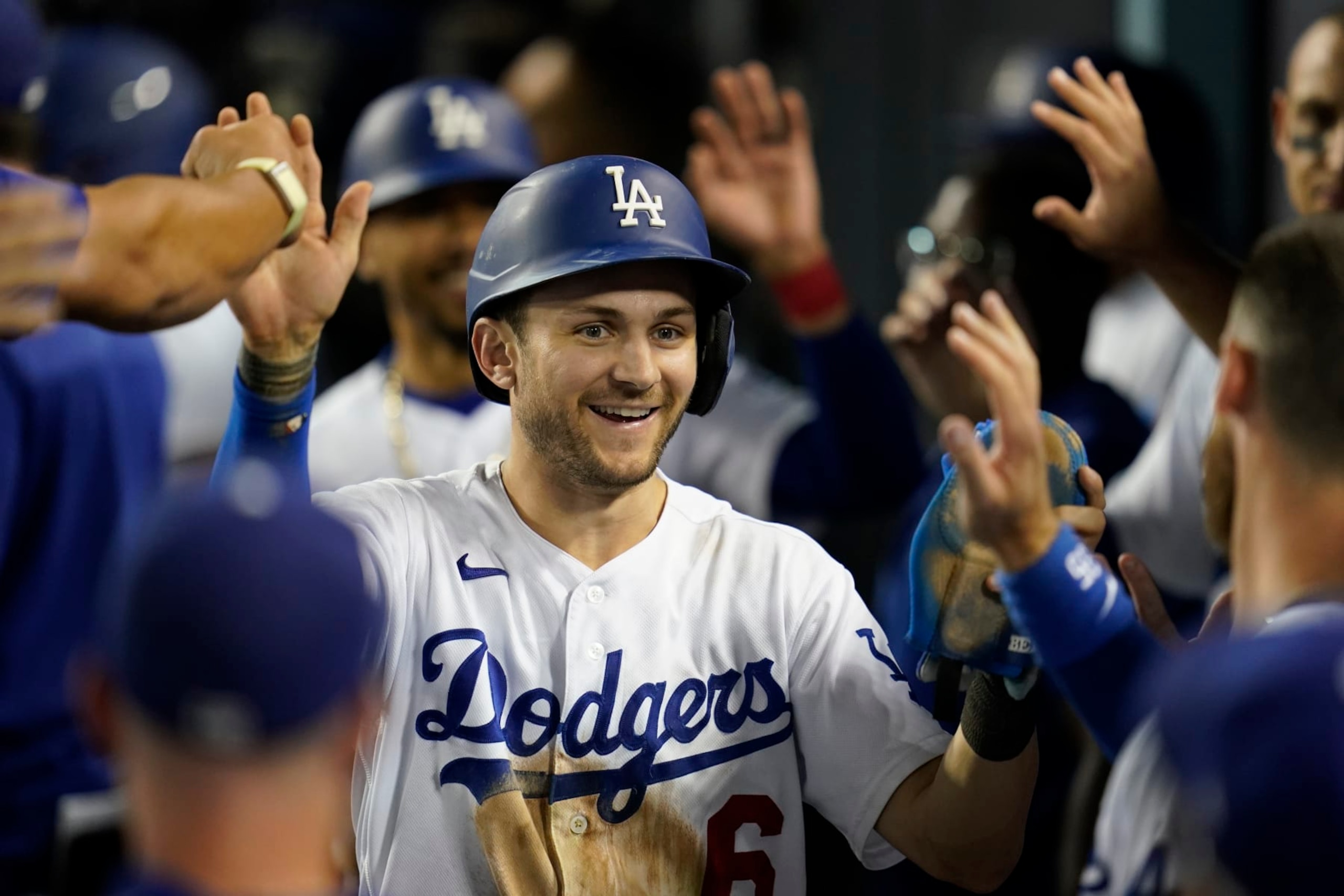 Los Angeles Dodgers' Trea Turner (6) celebrates in the dugout after scoring off of a double hit by Freddie Freeman during the eighth inning of a baseball game against the Milwaukee Brewers in Los Angeles, Tuesday, Aug. 23, 2022. Mookie Betts also scored. (AP Photo/Ashley Landis) Los Angeles Dodgers' Trea Turner (6) celebrates in the dugout after scoring off of a double hit by Freddie Freeman during the eighth inning of a baseball game against the Milwaukee Brewers in Los Angeles, Tuesday, Aug. 23, 2022. Mookie Betts also scored. (AP Photo/Ashley Landis)