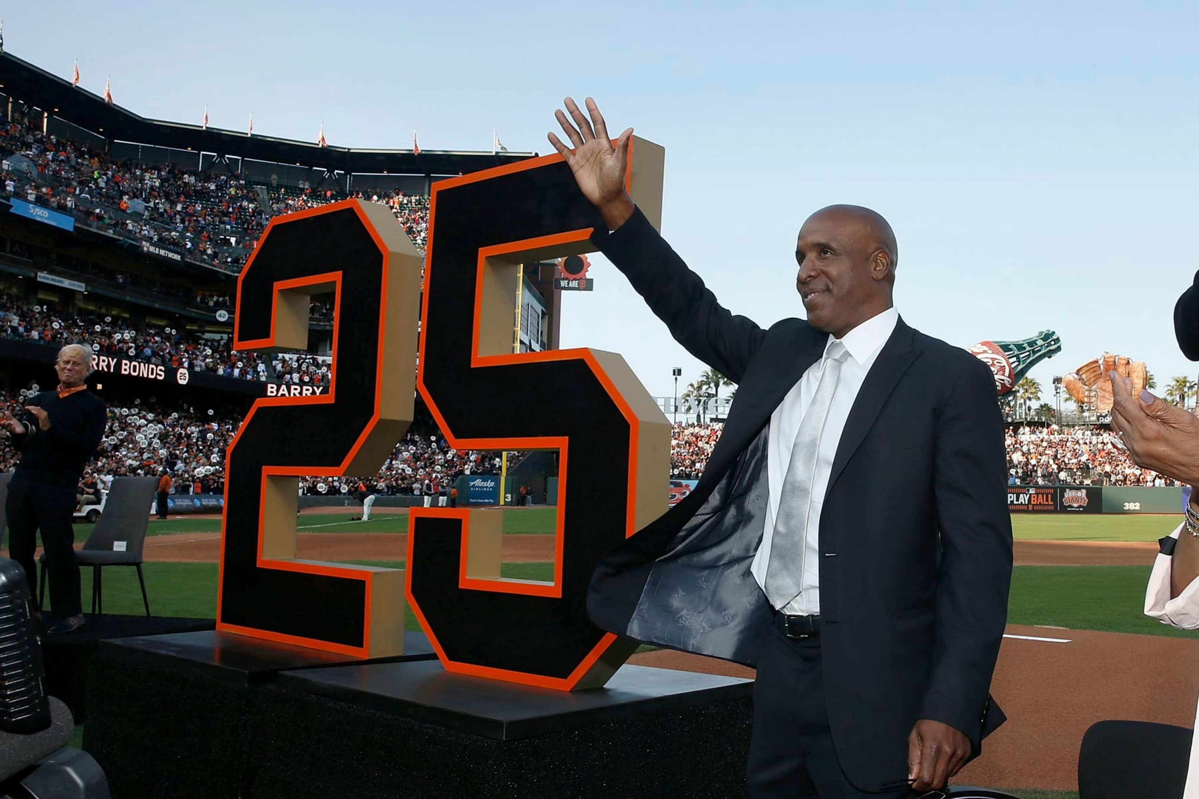 Former San Francisco Giants player Barry Bonds waves during a ceremony to retire his jersey number before a baseball game between the Giants and the Pittsburgh Pirates in San Francisco, Saturday, Aug. 11, 2018. (Lachlan Cunningham/Pool Photo via AP) Former San Francisco Giants player Barry Bonds waves during a ceremony to retire his jersey number before a baseball game between the Giants and the Pittsburgh Pirates in San Francisco, Saturday, Aug. 11, 2018. (Lachlan Cunningham/Pool Photo via AP)