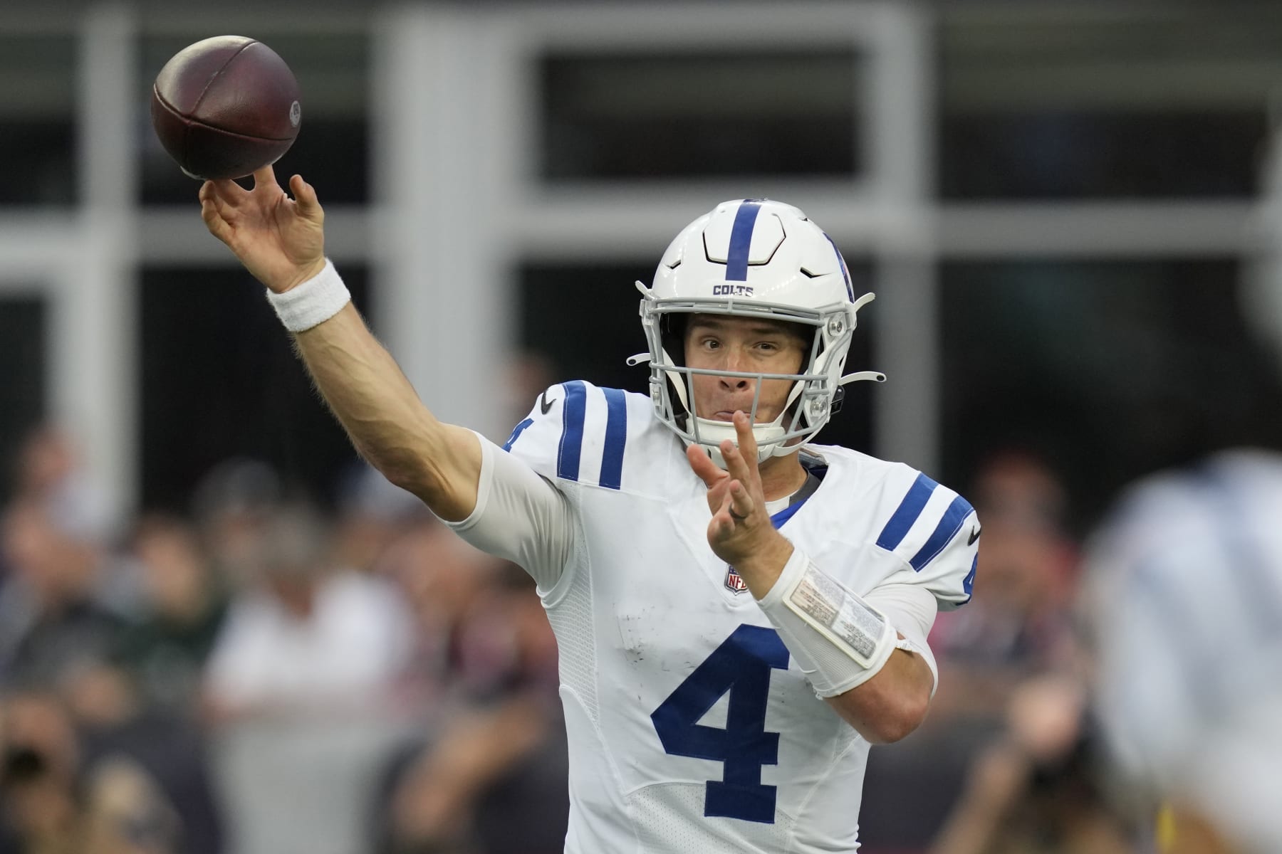 Indianapolis Colts quarterback Sam Ehlinger (4) passes during to an NFL football game between the Colts and the New England Patriots, Sunday, Nov. 6, 2022, in Foxborough, Mass. (AP Photo/Charles Krupa)
