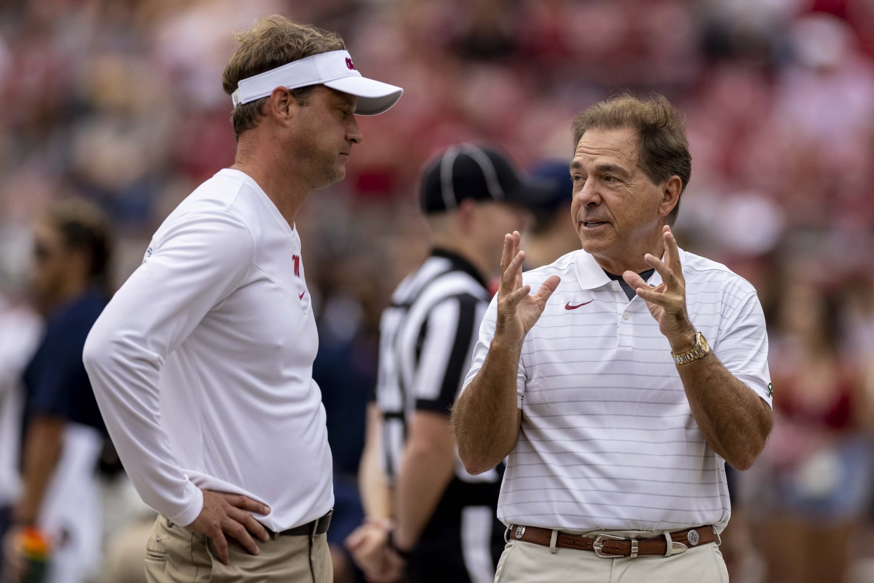 Mississippi head coach Lane Kiffin and Alabama head coach Nick Saban talk before an NCAA college football game, Saturday, Oct. 2, 2021, in Tuscaloosa, Ala. (AP Photo/Vasha Hunt)