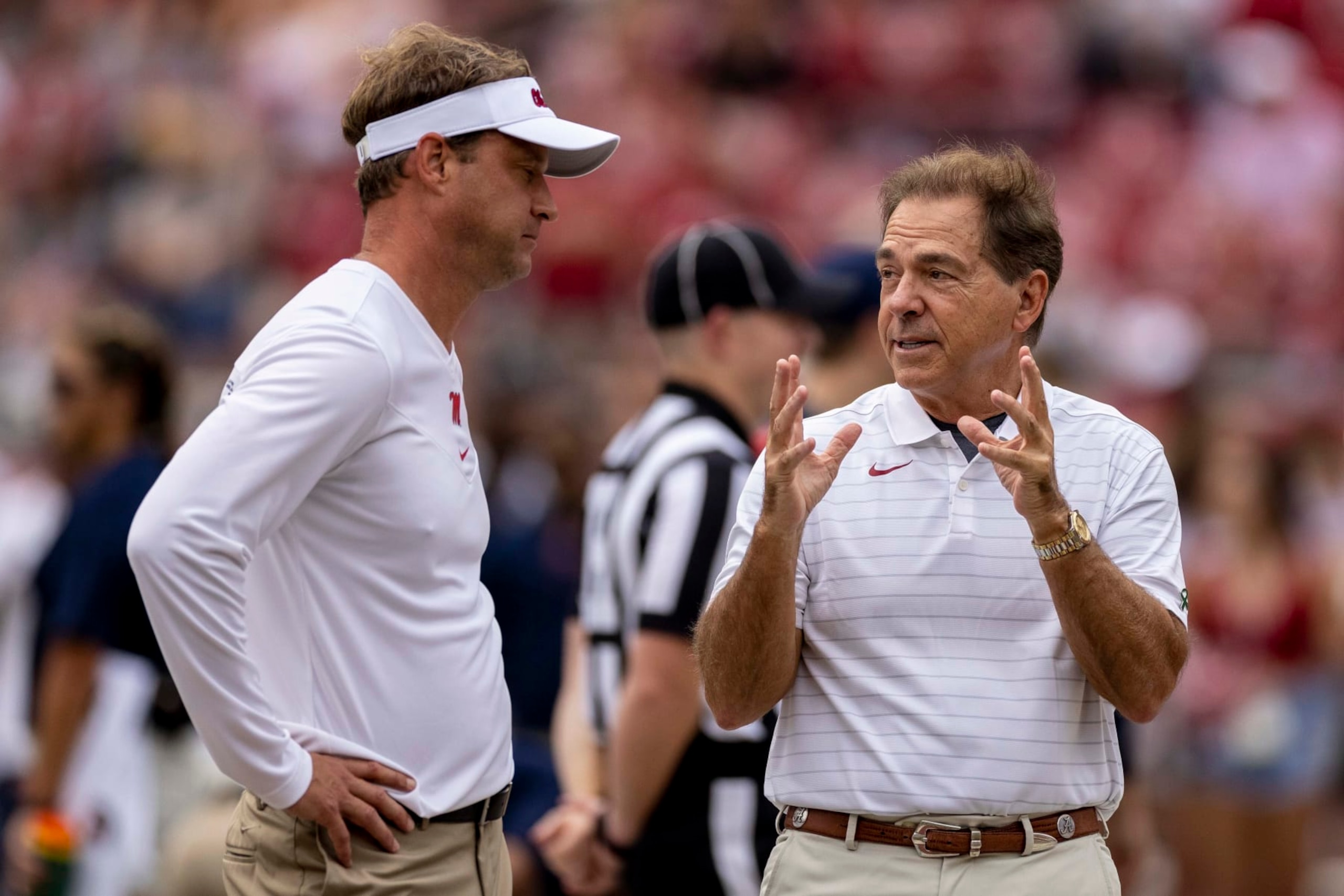 Mississippi head coach Lane Kiffin and Alabama head coach Nick Saban talk before an NCAA college football game, Saturday, Oct. 2, 2021, in Tuscaloosa, Ala. (AP Photo/Vasha Hunt)