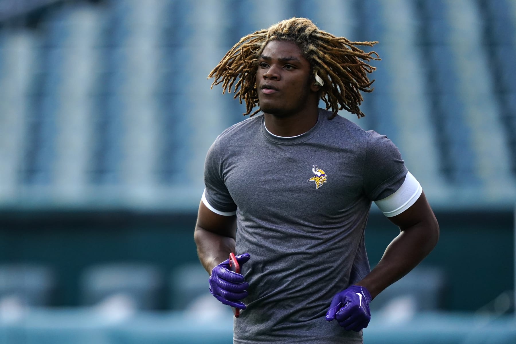 Minnesota Vikings safety Lewis Cine warms up before an NFL football game against the Philadelphia Eagles, Monday, Sept. 19, 2022, in Philadelphia. (AP Photo/Matt Rourke)