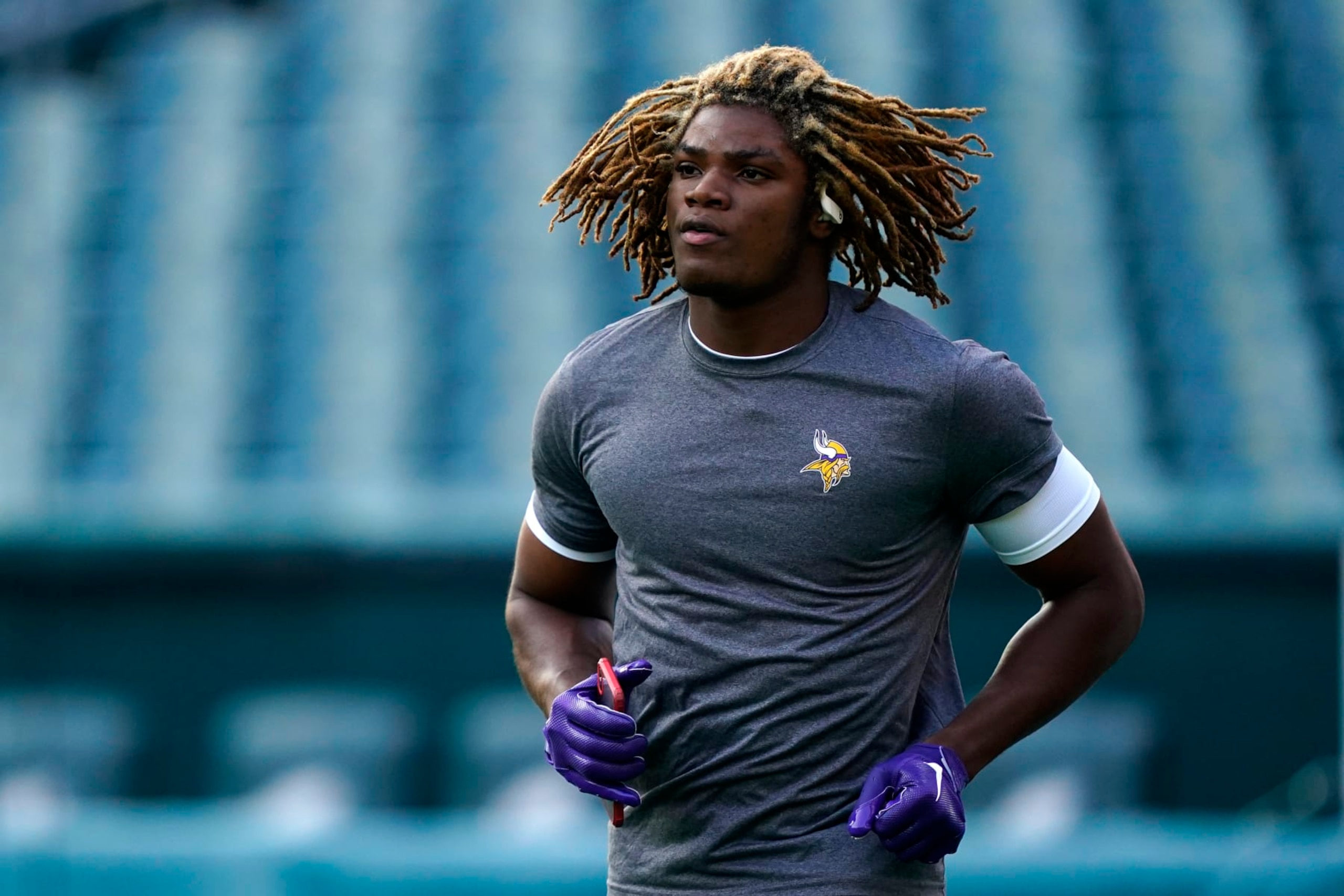 Minnesota Vikings safety Lewis Cine warms up before an NFL football game against the Philadelphia Eagles, Monday, Sept. 19, 2022, in Philadelphia. (AP Photo/Matt Rourke)