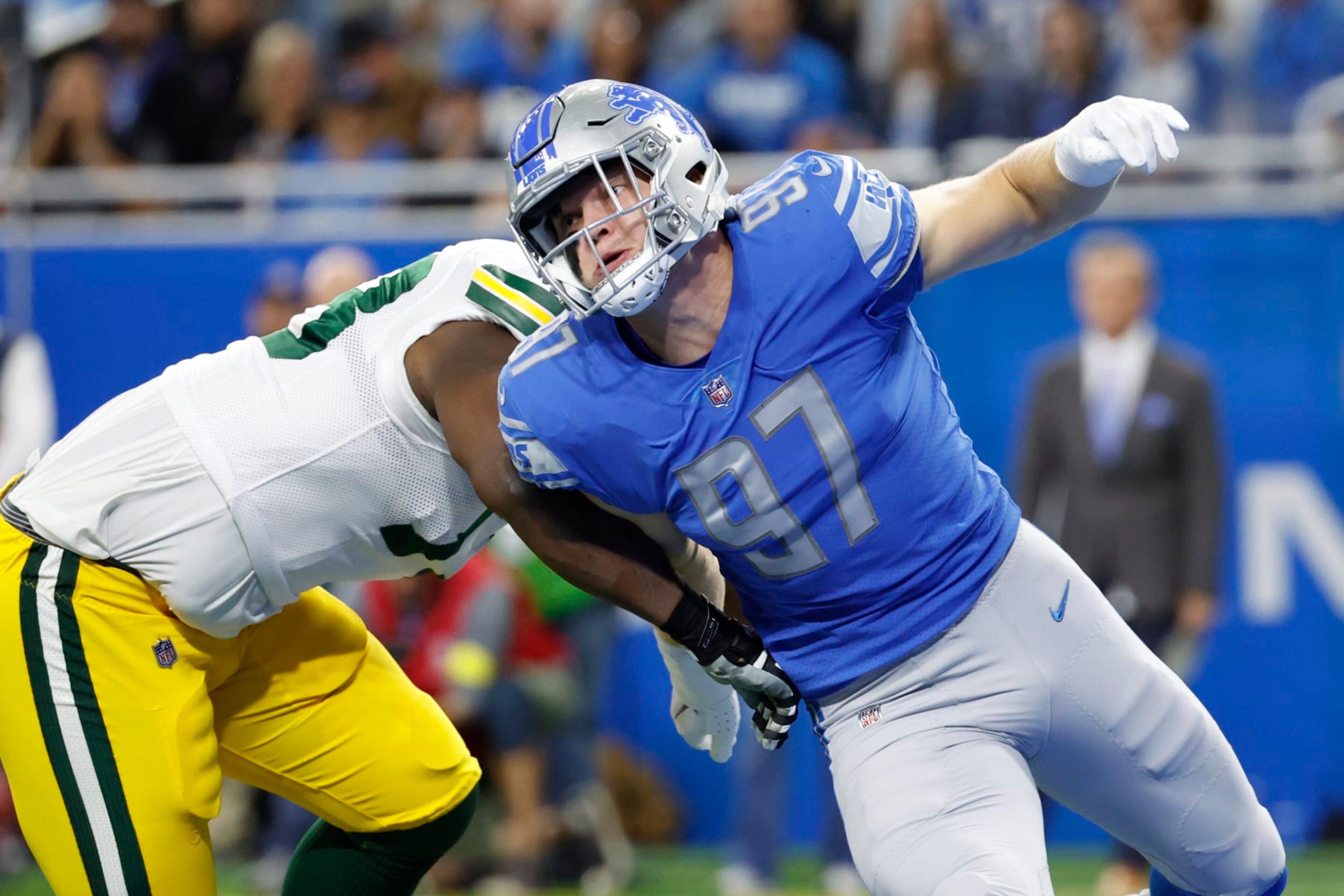 Detroit Lions defensive end Aidan Hutchinson (97) rushes on defense at Green Bay Packers offensive tackle Yosh Nijman (73) in the first half during an NFL football game, Sunday, Nov. 6, 2022, in Detroit. (AP Photo/Rick Osentoski)