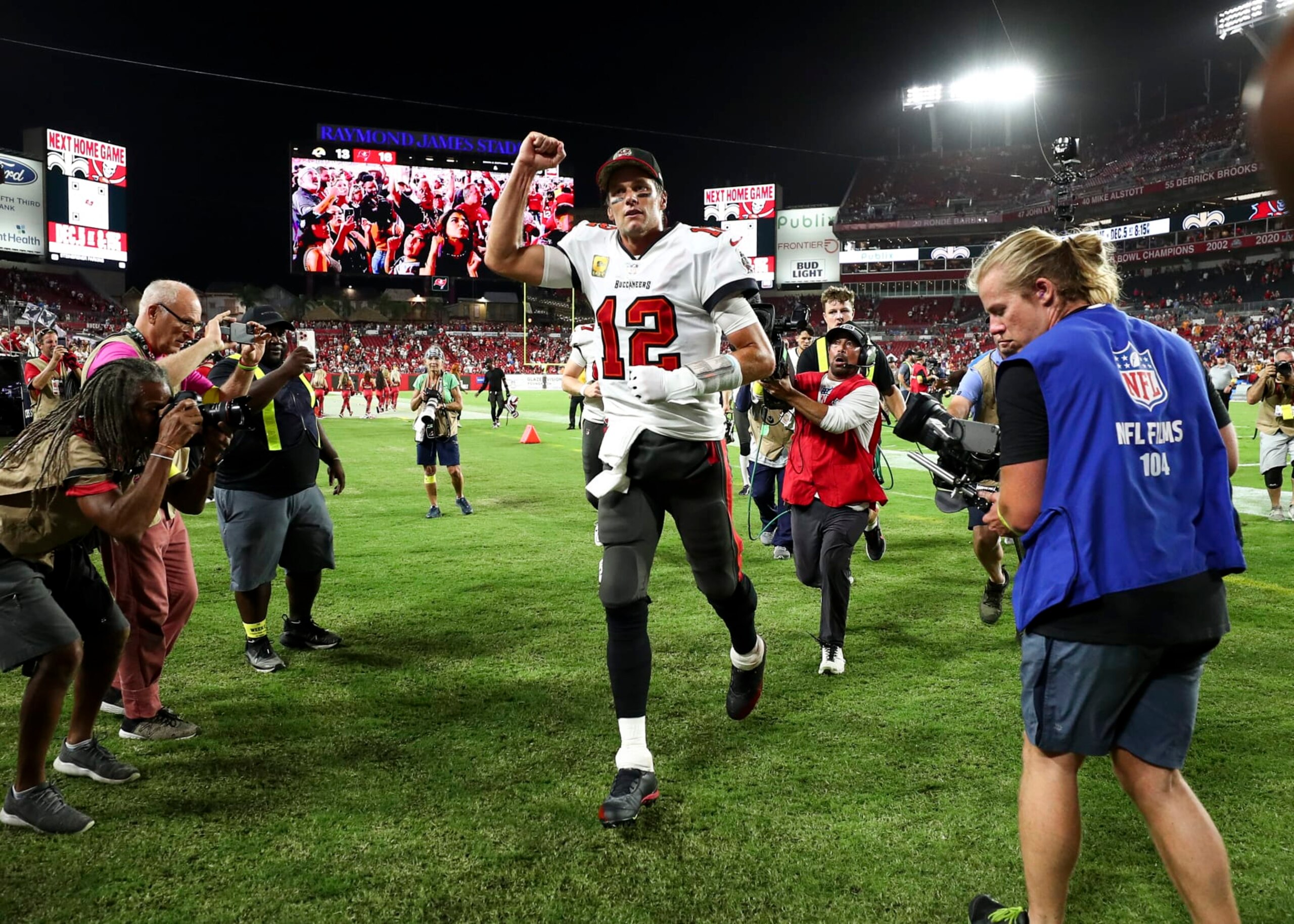 TAMPA, FL - NOVEMBER 6: Tom Brady #12 of the Tampa Bay Buccaneers celebrates with fans after an NFL football game against the Los Angeles Rams at Raymond James Stadium on November 6, 2022 in Tampa, Florida. (Photo by Kevin Sabitus/Getty Images) TAMPA, FL - NOVEMBER 6: Tom Brady #12 of the Tampa Bay Buccaneers celebrates with fans after an NFL football game against the Los Angeles Rams at Raymond James Stadium on November 6, 2022 in Tampa, Florida. (Photo by Kevin Sabitus/Getty Images)