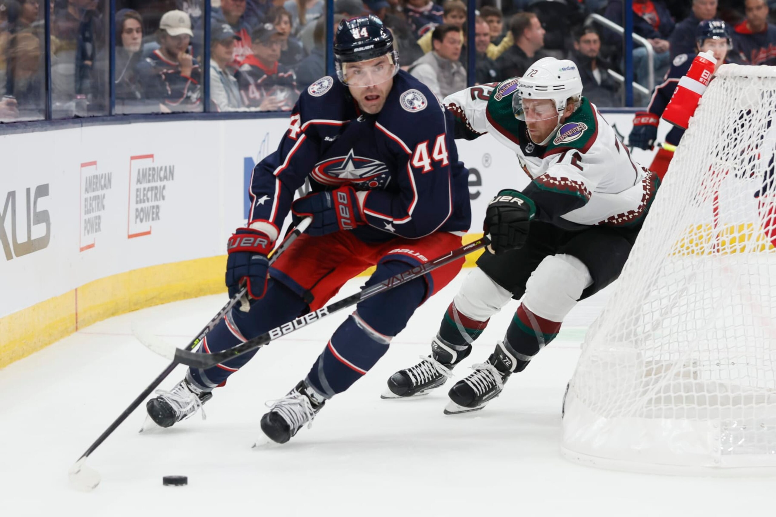 Columbus Blue Jackets' Erik Gudbranson, left, looks for an open pass as Arizona Coyotes' Travis Boyd chases him during the first period of an NHL hockey game Tuesday, Oct. 25, 2022, in Columbus, Ohio. (AP Photo/Jay LaPrete) Columbus Blue Jackets' Erik Gudbranson, left, looks for an open pass as Arizona Coyotes' Travis Boyd chases him during the first period of an NHL hockey game Tuesday, Oct. 25, 2022, in Columbus, Ohio. (AP Photo/Jay LaPrete)