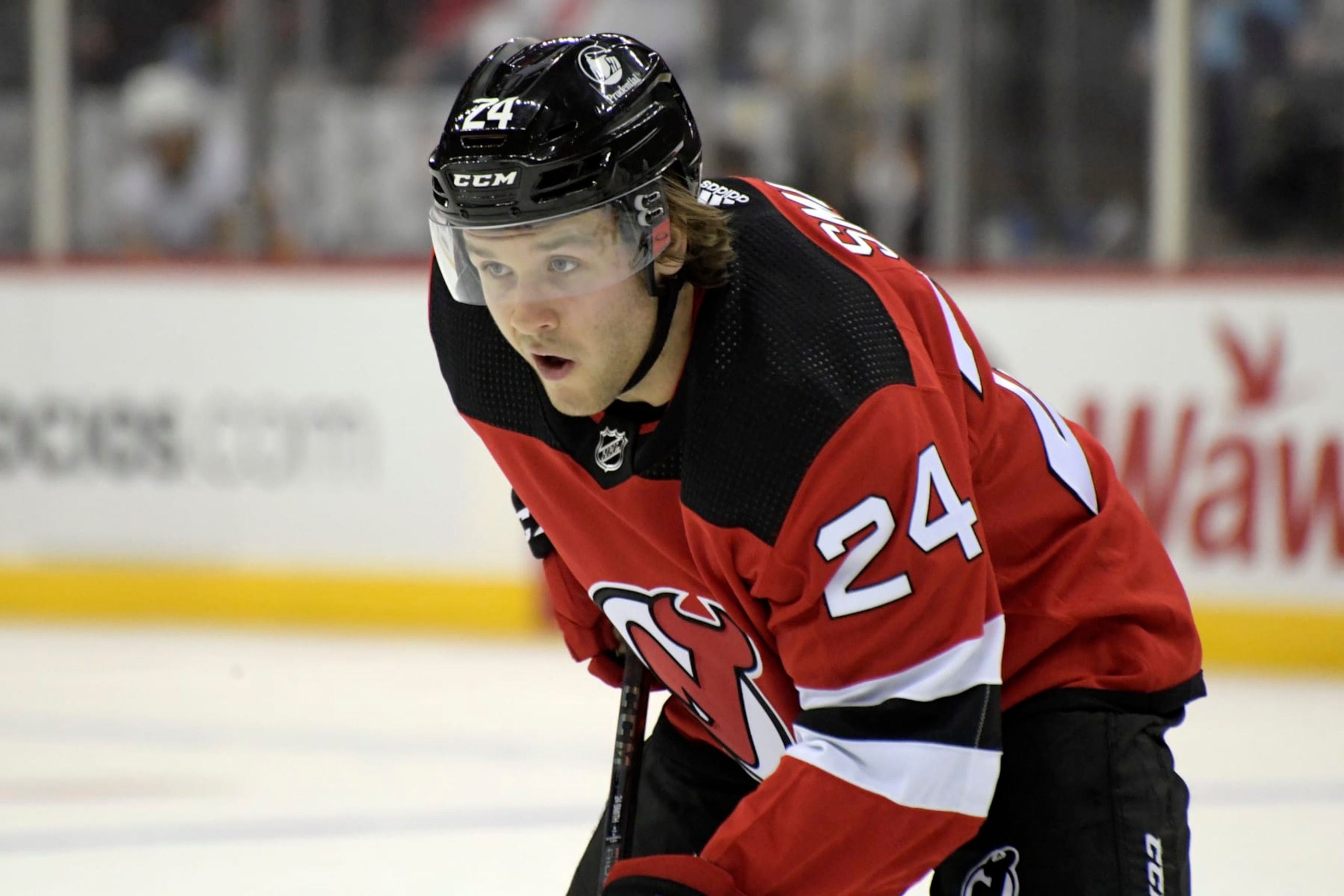 New Jersey Devils defenseman Ty Smith (24) during the second period of an NHL hockey game against the Pittsburgh Penguins Sunday, Dec. 19, 2021, in Newark, N.J. (AP Photo/Bill Kostroun) New Jersey Devils defenseman Ty Smith (24) during the second period of an NHL hockey game against the Pittsburgh Penguins Sunday, Dec. 19, 2021, in Newark, N.J. (AP Photo/Bill Kostroun)