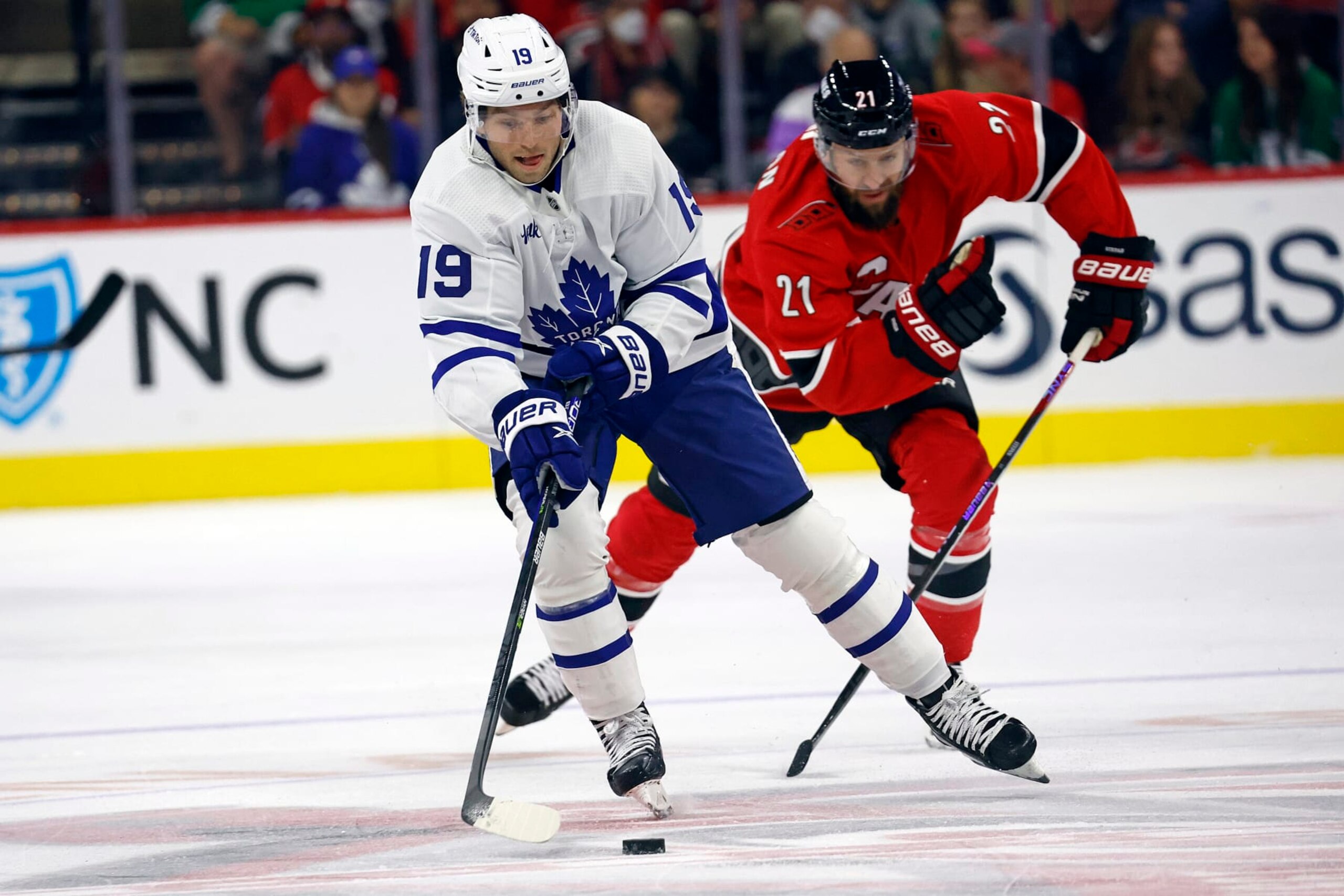 Toronto Maple Leafs' Calle Jarnkrok (19) controls the puck in front of Carolina Hurricanes' Derek Stepan (21) during the first period of an NHL hockey game in Raleigh, N.C., Sunday, Nov. 6, 2022. (AP Photo/Karl B DeBlaker) Toronto Maple Leafs' Calle Jarnkrok (19) controls the puck in front of Carolina Hurricanes' Derek Stepan (21) during the first period of an NHL hockey game in Raleigh, N.C., Sunday, Nov. 6, 2022. (AP Photo/Karl B DeBlaker)