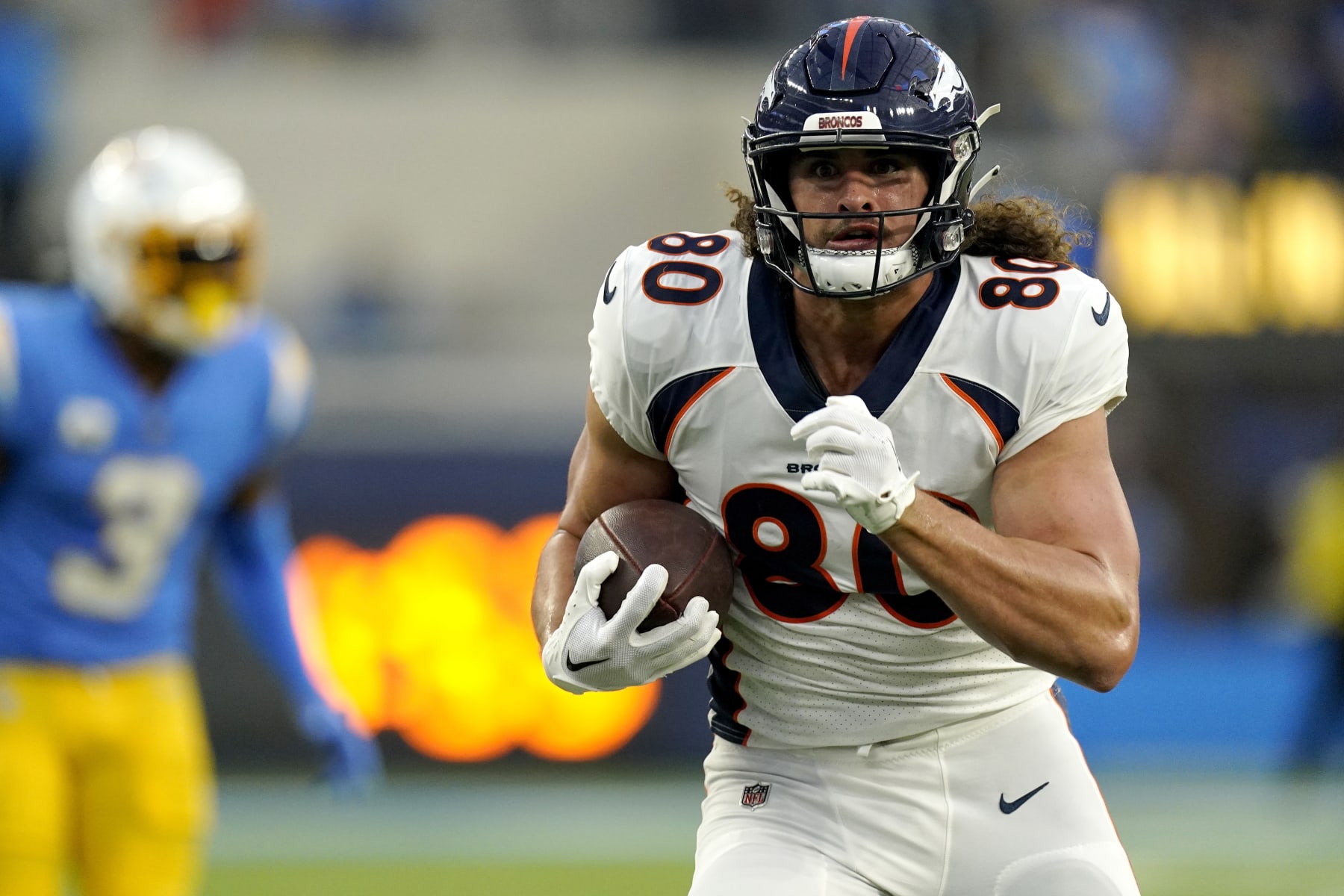 Denver Broncos tight end Greg Dulcich (80) pulls in a touchdown catch against the Los Angeles Chargers during the first half of an NFL football game, Monday, Oct. 17, 2022, in Inglewood, Calif. (AP Photo/Mark J. Terrill)