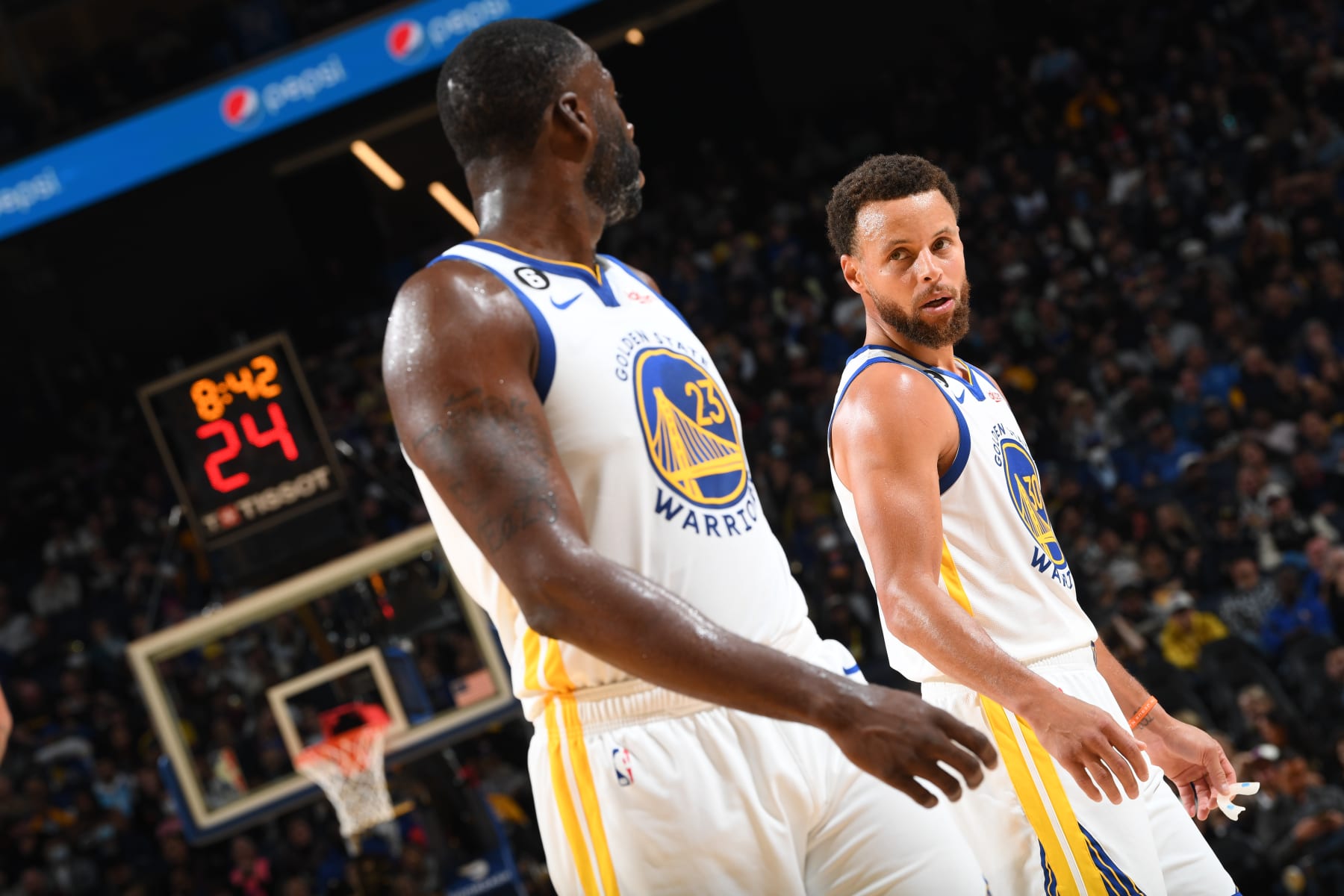SAN FRANCISCO, CA - OCTOBER 27: Stephen Curry #30 of the Golden State Warriors and Draymond Green #23 look on during the game against the Miami Heat on October 27, 2022 at Chase Center in San Francisco, California. NOTE TO USER: User expressly acknowledges and agrees that, by downloading and or using this photograph, user is consenting to the terms and conditions of Getty Images License Agreement. Mandatory Copyright Notice: Copyright 2022 NBAE (Photo by Noah Graham/NBAE via Getty Images)