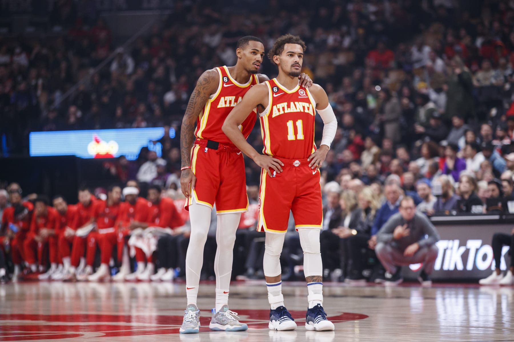 TORONTO, ON - OCTOBER 31: Dejounte Murray #5 and Trae Young #11 of the Atlanta Hawks talk between plays against the Toronto Raptors at Scotiabank Arena on October 31, 2022 in Toronto, Canada. NOTE TO USER: User expressly acknowledges and agrees that, by downloading and or using this photograph, User is consenting to the terms and conditions of the Getty Images License Agreement. (Photo by Cole Burston/Getty Images
