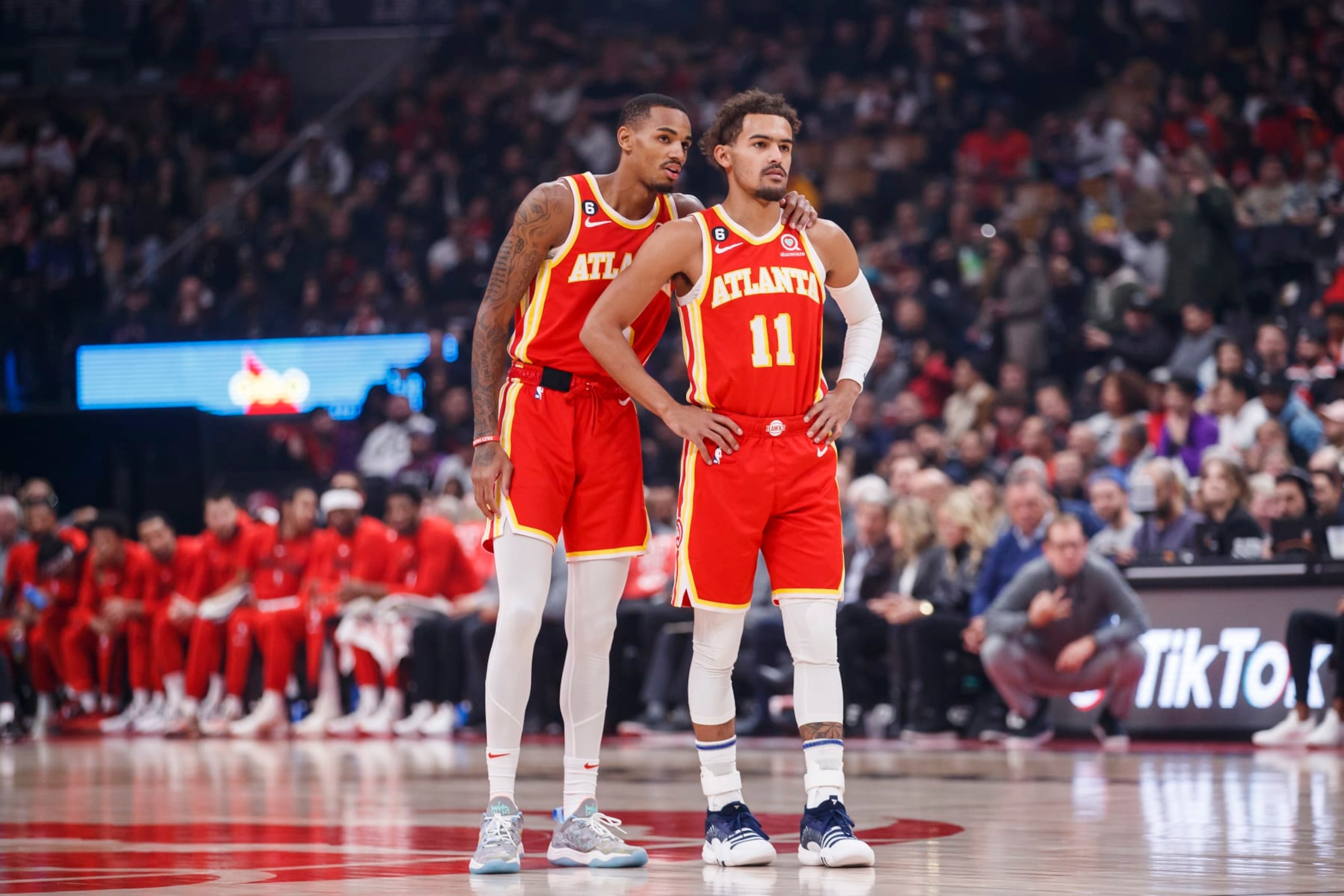 TORONTO, ON - OCTOBER 31: Dejounte Murray #5 and Trae Young #11 of the Atlanta Hawks talk between plays against the Toronto Raptors at Scotiabank Arena on October 31, 2022 in Toronto, Canada. NOTE TO USER: User expressly acknowledges and agrees that, by downloading and or using this photograph, User is consenting to the terms and conditions of the Getty Images License Agreement. (Photo by Cole Burston/Getty Images