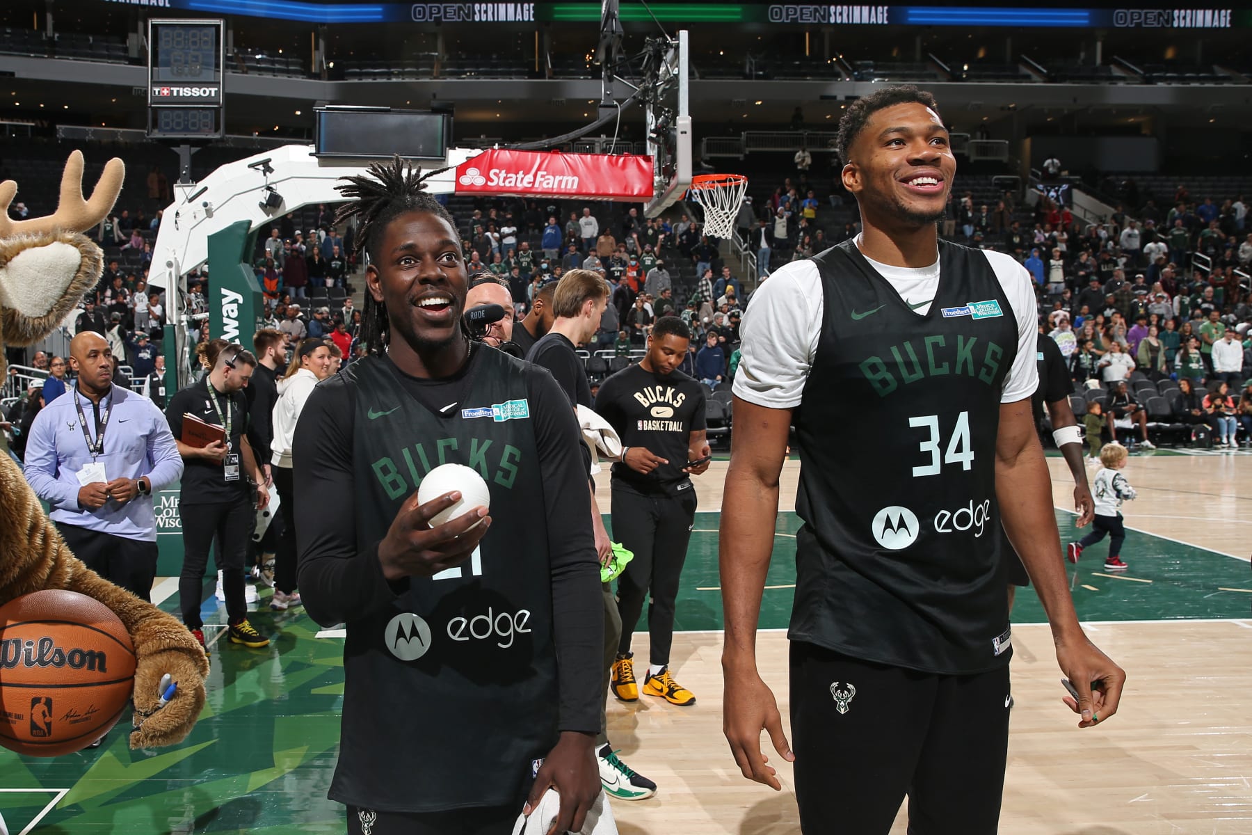 MILWAUKEE, WI - OCTOBER 15: Jrue Holiday #21 and Giannis Antetokounmpo #34 of the Milwaukee Bucks smilesduring an open practice on October 15, 2022 at the Fiserv Forum Center in Milwaukee, Wisconsin. NOTE TO USER: User expressly acknowledges and agrees that, by downloading and or using this Photograph, user is consenting to the terms and conditions of the Getty Images License Agreement. Mandatory Copyright Notice: Copyright 2022 NBAE (Photo by Gary Dineen/NBAE via Getty Images)