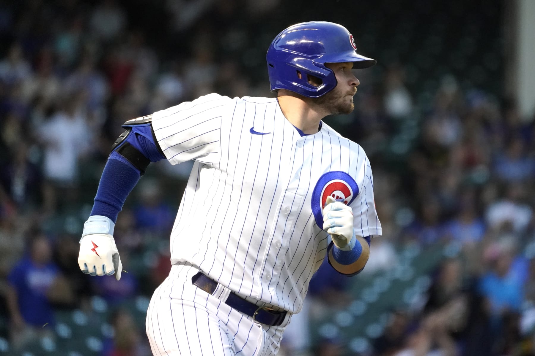 Chicago Cubs' Ian Happ watches his homer off Cincinnati Reds starting pitcher Justin Dunn during the first inning of a baseball game Tuesday, Sept. 6, 2022, in Chicago. (AP Photo/Charles Rex Arbogast)