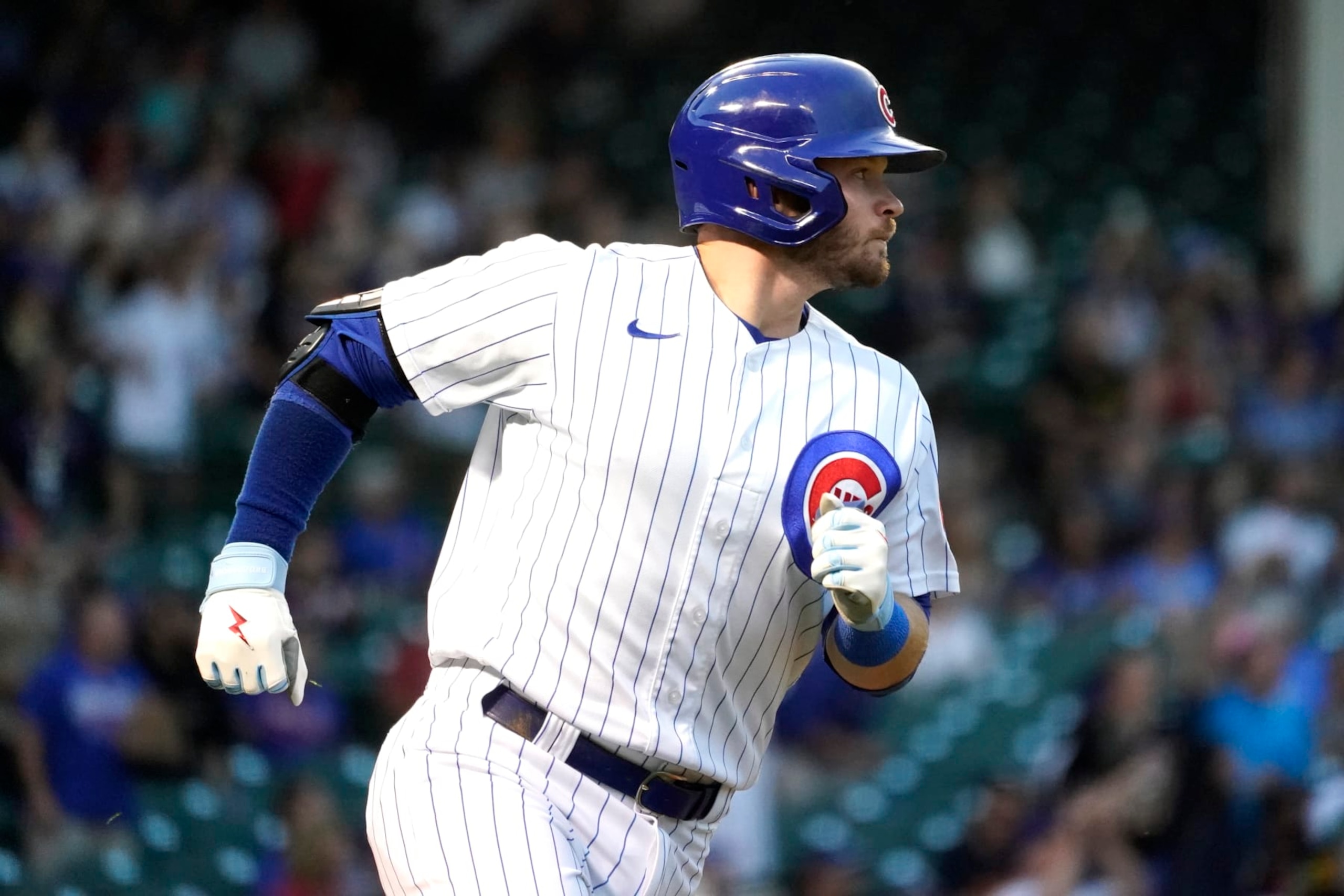 Chicago Cubs' Ian Happ watches his homer off Cincinnati Reds starting pitcher Justin Dunn during the first inning of a baseball game Tuesday, Sept. 6, 2022, in Chicago. (AP Photo/Charles Rex Arbogast)