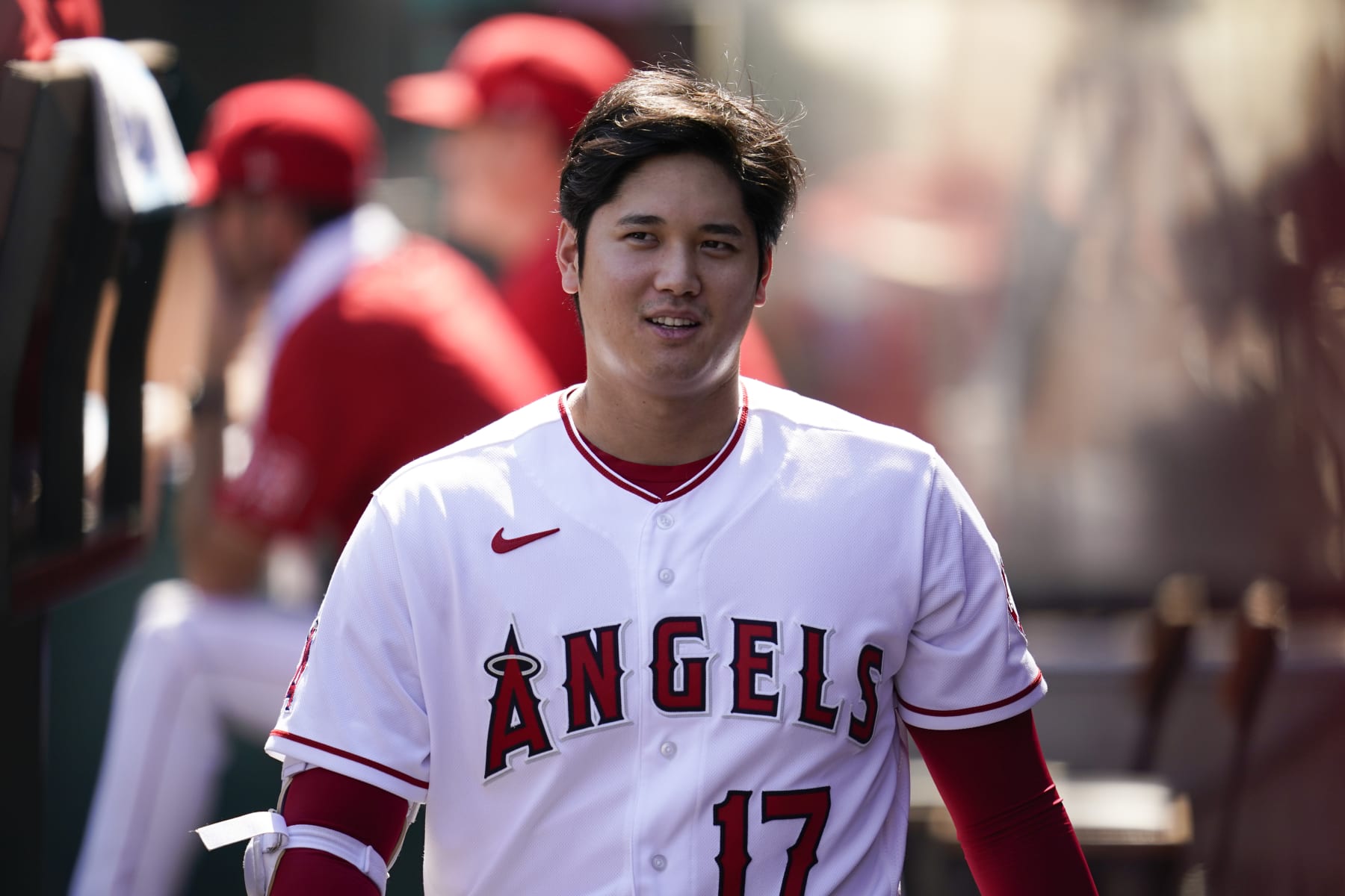 Los Angeles Angels designated hitter Shohei Ohtani (17) walks in the dugout during the first inning of a baseball game against the Texas Rangers in Anaheim, Calif., Sunday, Oct. 2, 2022. (AP Photo/Ashley Landis)