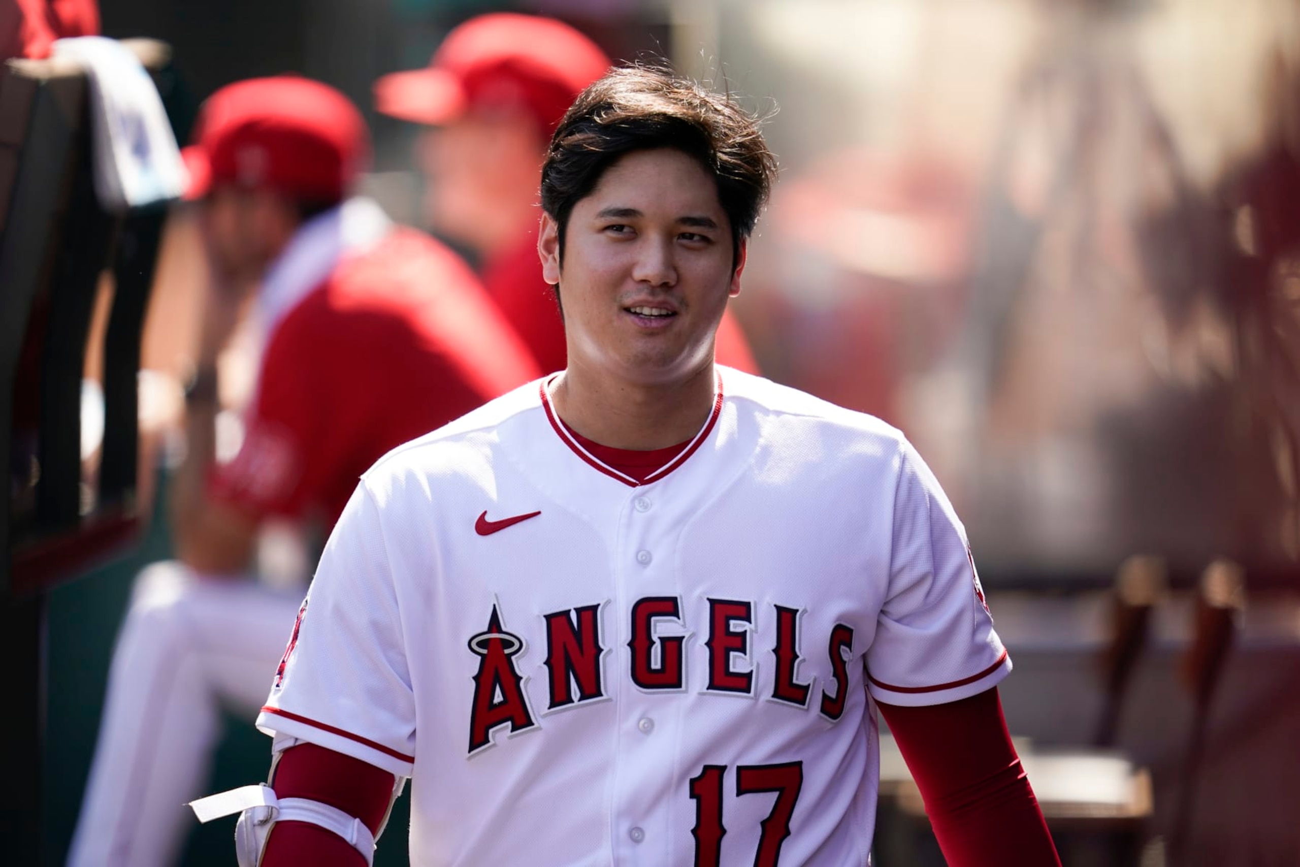Los Angeles Angels designated hitter Shohei Ohtani (17) walks in the dugout during the first inning of a baseball game against the Texas Rangers in Anaheim, Calif., Sunday, Oct. 2, 2022. (AP Photo/Ashley Landis)