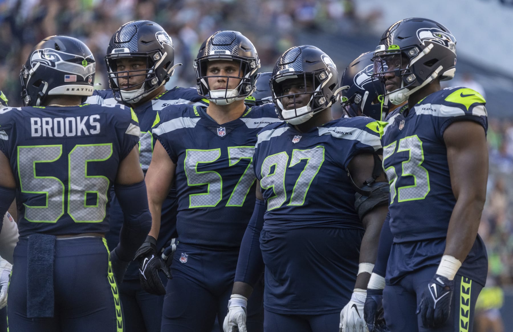 Member of the Seattle Seahawks defense from left, linebacker Jordyn Brooks, defensive lineman Al Woods, linebacker Cody Barton, defensive lineman Poona Ford and linebacker Boye Mafean are pictured during an NFL football game, Sunday, Sept. 25, 2022, in Seattle. The Falcons won 27-23. (AP Photo/Stephen Brashear)
