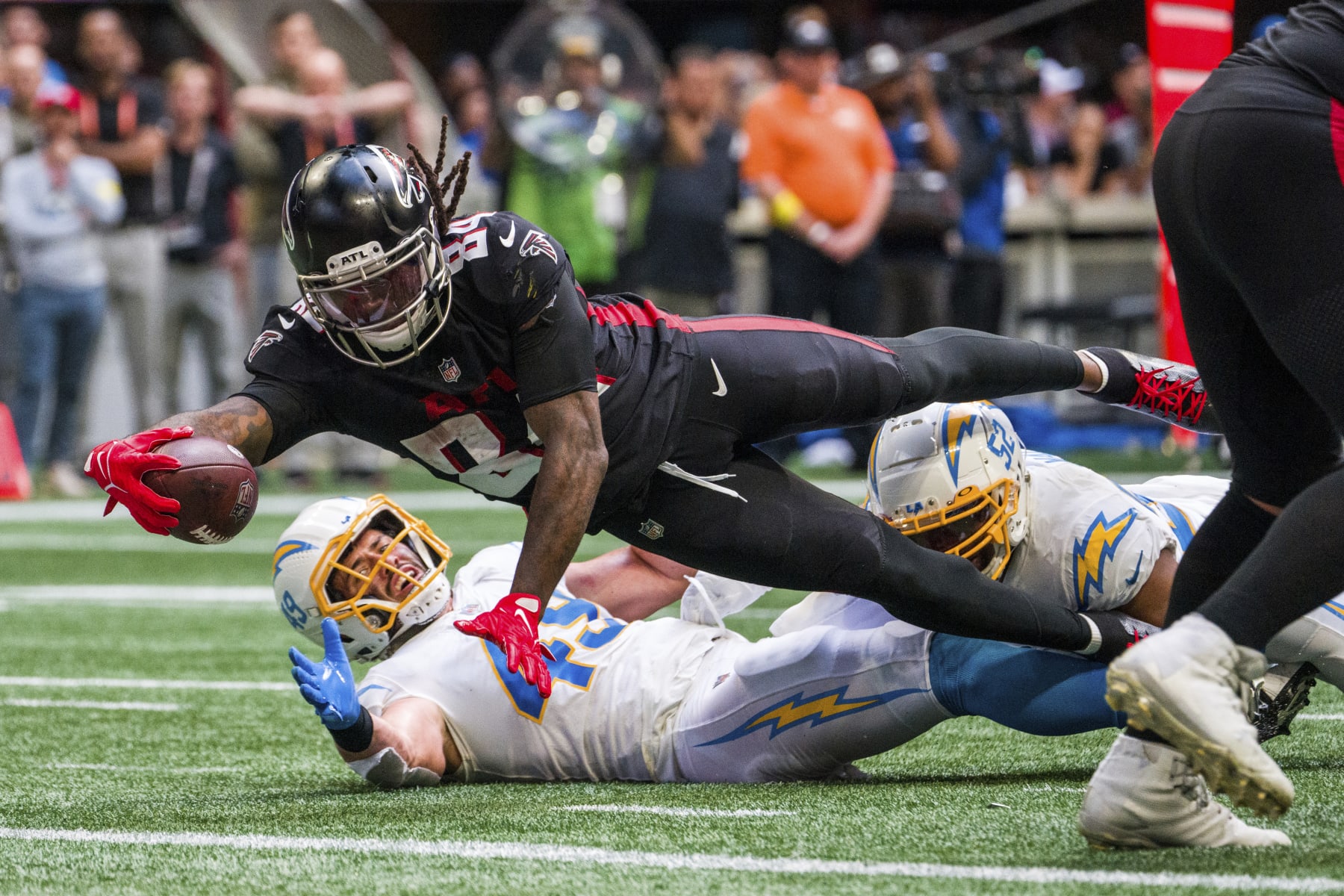 Atlanta Falcons running back Cordarrelle Patterson (84) dives into the end zone for a touchdown during the second half of an NFL football game against the Los Angeles Chargers, Sunday, Nov. 6, 2022, in Atlanta. The Los Angeles Chargers won 20-17. (AP Photo/Danny Karnik)