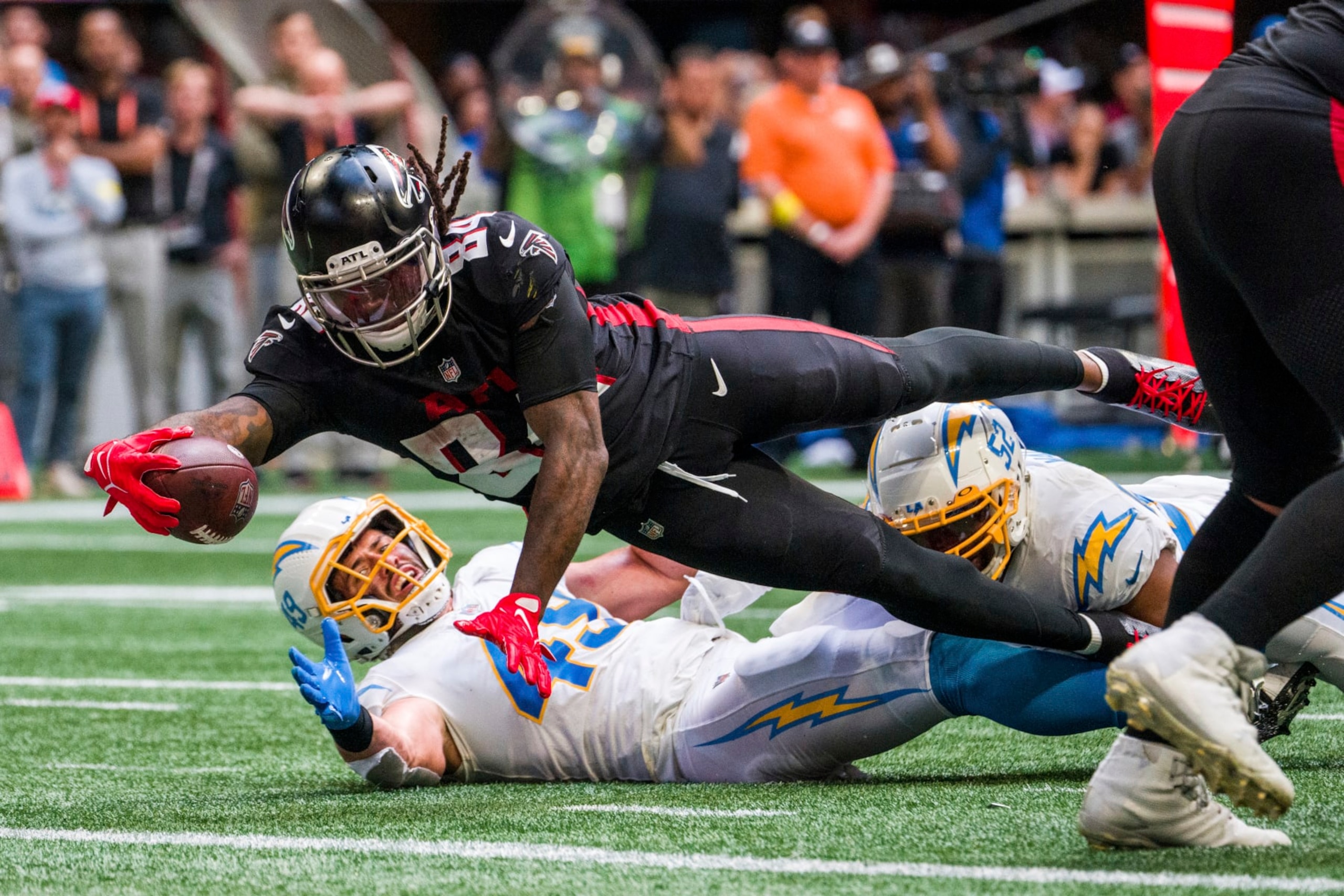 Atlanta Falcons running back Cordarrelle Patterson (84) dives into the end zone for a touchdown during the second half of an NFL football game against the Los Angeles Chargers, Sunday, Nov. 6, 2022, in Atlanta. The Los Angeles Chargers won 20-17. (AP Photo/Danny Karnik)