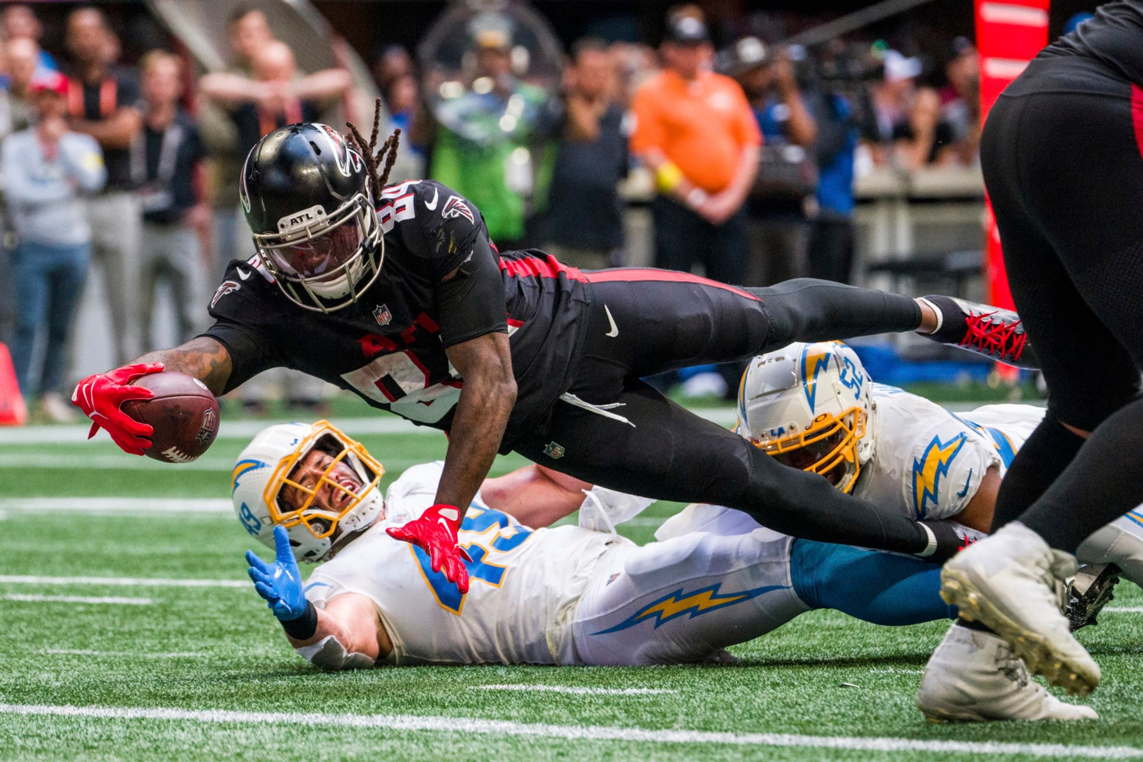 Atlanta Falcons running back Cordarrelle Patterson (84) dives into the end zone for a touchdown during the second half of an NFL football game against the Los Angeles Chargers, Sunday, Nov. 6, 2022, in Atlanta. The Los Angeles Chargers won 20-17. (AP Photo/Danny Karnik)