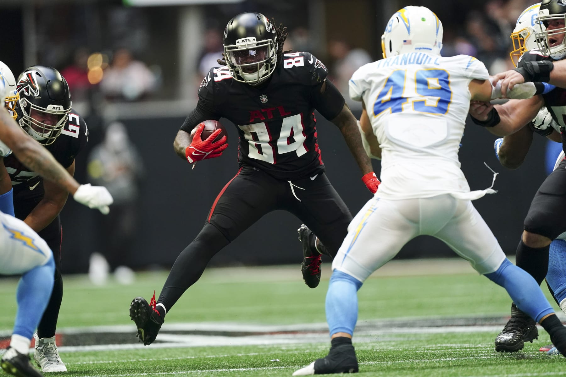 Atlanta Falcons running back Cordarrelle Patterson (84) runs from Los Angeles Chargers linebacker Drue Tranquill (49) during the second half of an NFL football game, Sunday, Nov. 6, 2022, in Atlanta. (AP Photo/John Bazemore)