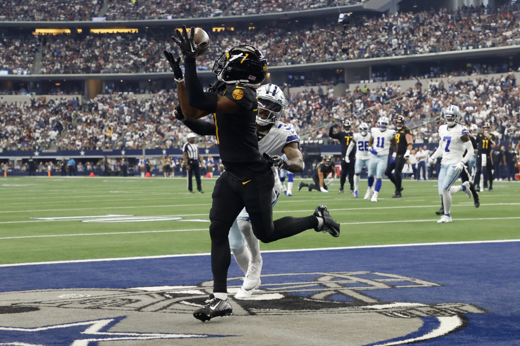 Washington Commanders wide receiver Jahan Dotson (1) reaches up to catch a touchdown pass in front of Dallas Cowboys cornerback Anthony Brown, rear, in the first half of a NFL football game in Arlington, Texas, Sunday, Oct. 2, 2022. (AP Photo/Michael Ainsworth)