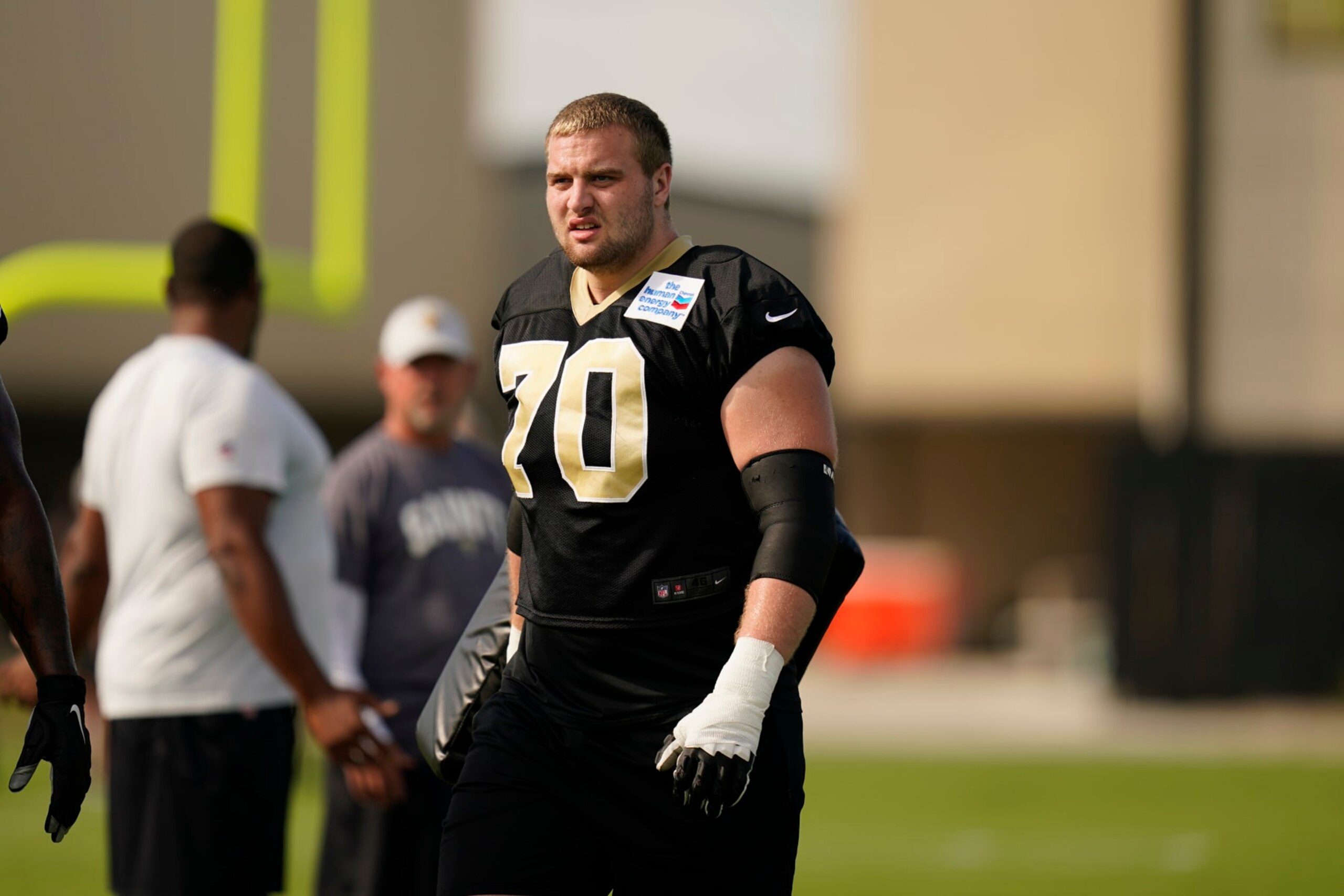 New Orleans Saints offensive tackle Trevor Penning (70) participates in drills during training camp at their NFL football training facility in Metairie, La., Saturday, July 30, 2022. (AP Photo/Gerald Herbert)