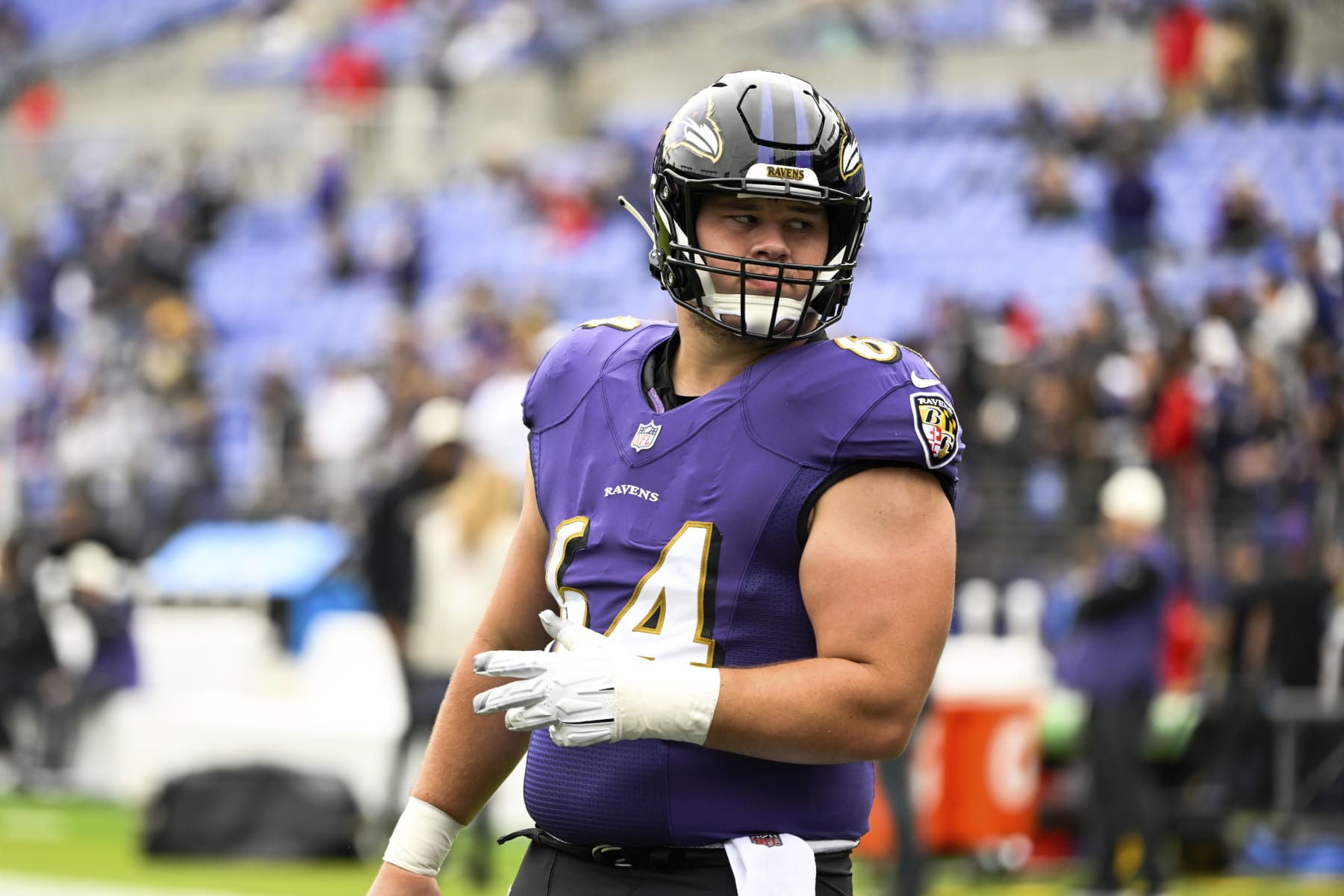 Baltimore Ravens center Tyler Linderbaum (64) looks on during pre-game warm-ups before a NFL football game against the Cleveland Browns, Sunday, Oct. 23, 2022, in Baltimore. (AP Photo/Terrance Williams)
