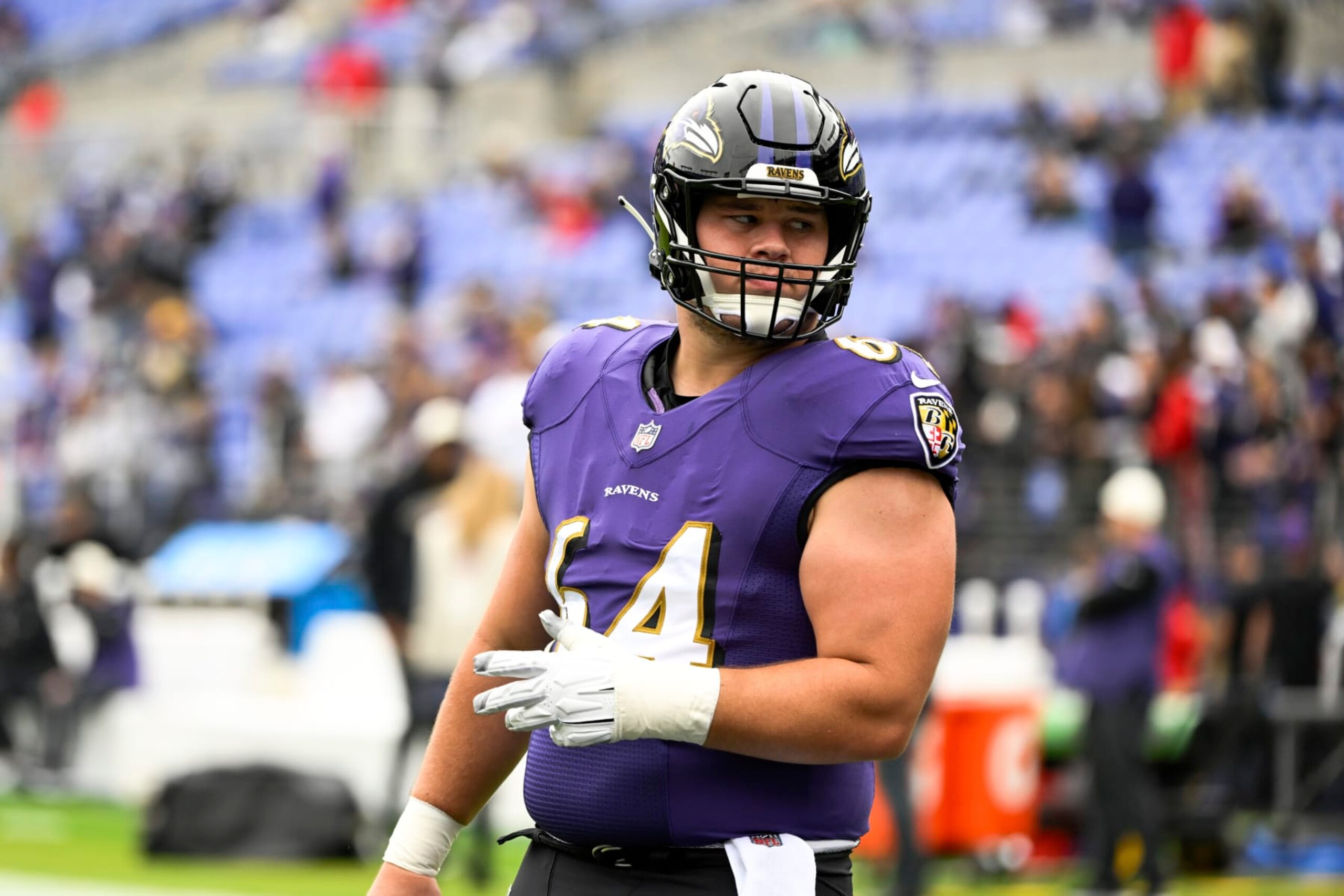Baltimore Ravens center Tyler Linderbaum (64) looks on during pre-game warm-ups before a NFL football game against the Cleveland Browns, Sunday, Oct. 23, 2022, in Baltimore. (AP Photo/Terrance Williams)
