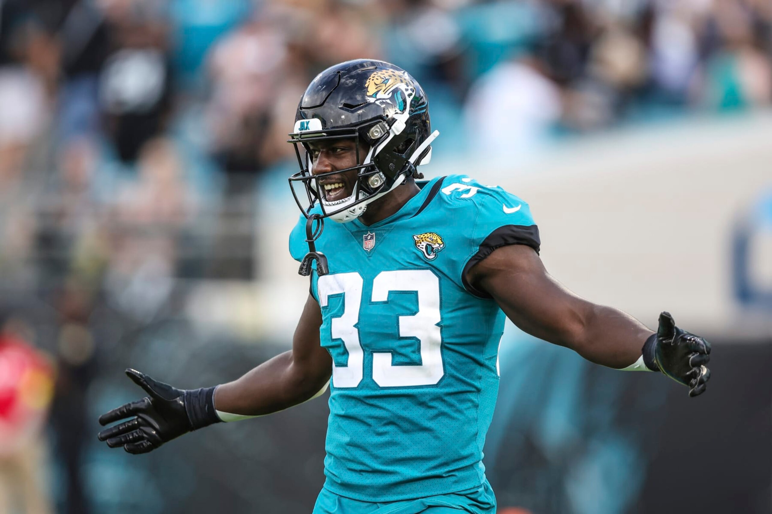 Jacksonville Jaguars linebacker Devin Lloyd (33) celebrates near the end of an NFL football game against the Las Vegas Raiders on Sunday, Nov. 6, 2022, in Jacksonville, Fla. (AP Photo/Gary McCullough)