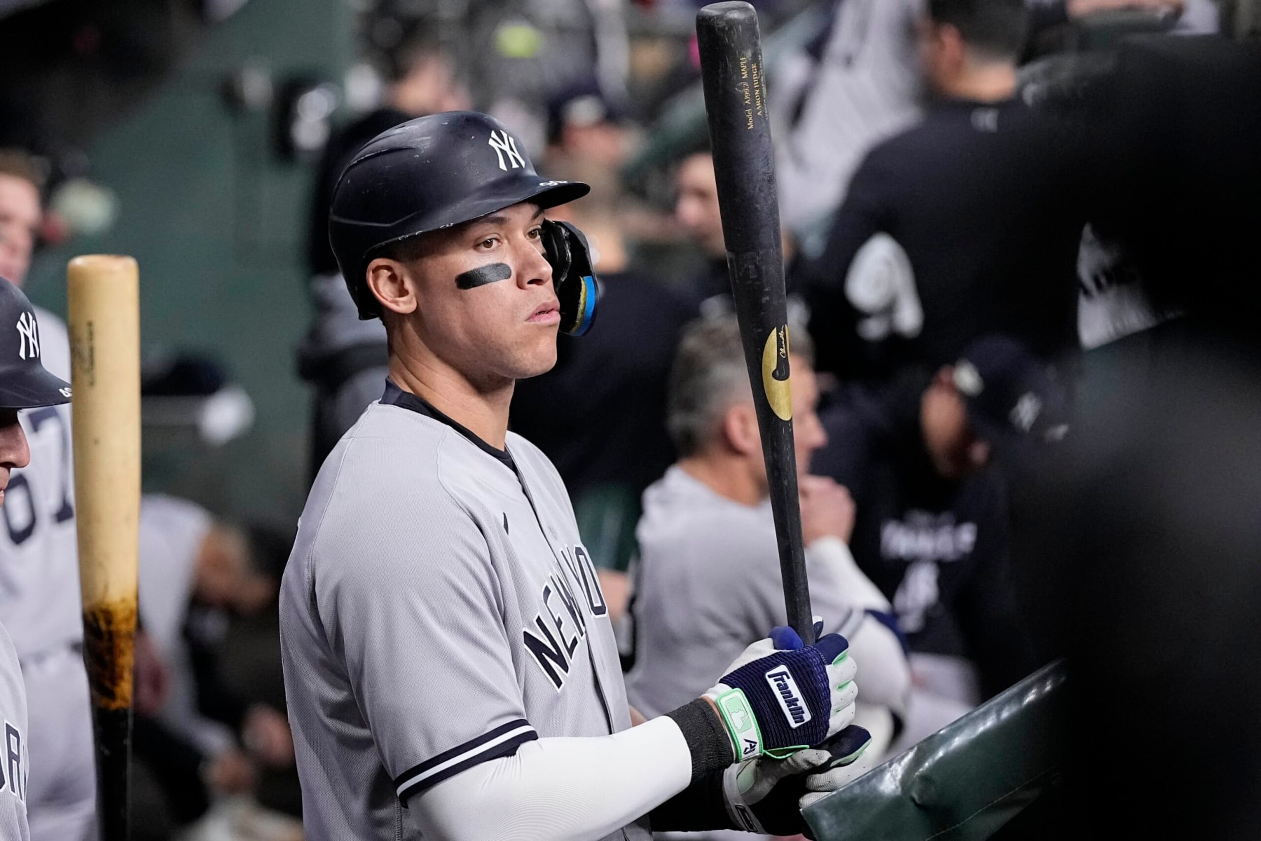 New York Yankees Aaron Judge stands in the dugout ahead of Game 1 of baseball's American League Championship Series between the Houston Astros and the New York Yankees, Wednesday, Oct. 19, 2022, in Houston. (AP Photo/Kevin M. Cox)