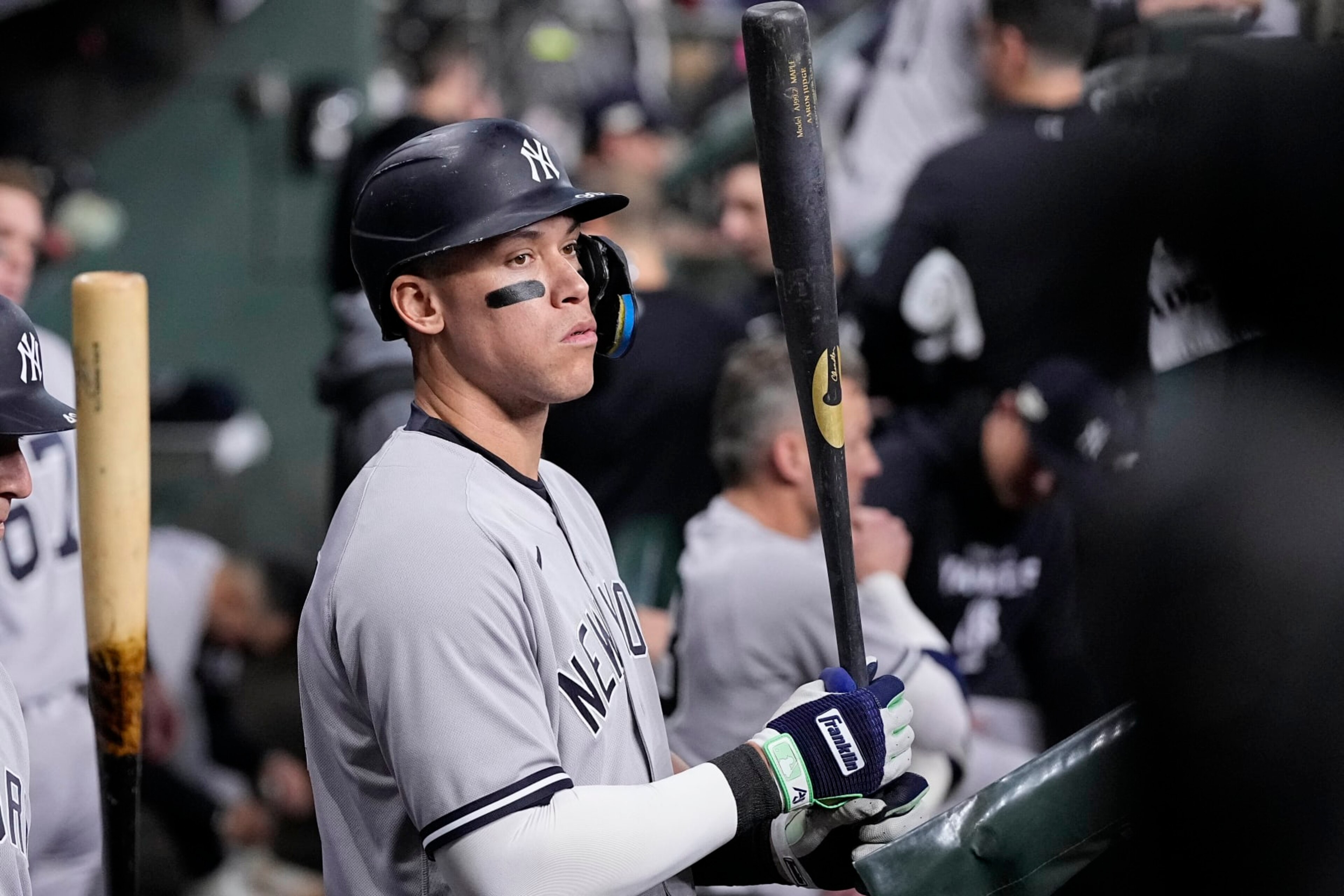 New York Yankees Aaron Judge stands in the dugout ahead of Game 1 of baseball's American League Championship Series between the Houston Astros and the New York Yankees, Wednesday, Oct. 19, 2022, in Houston. (AP Photo/Kevin M. Cox)