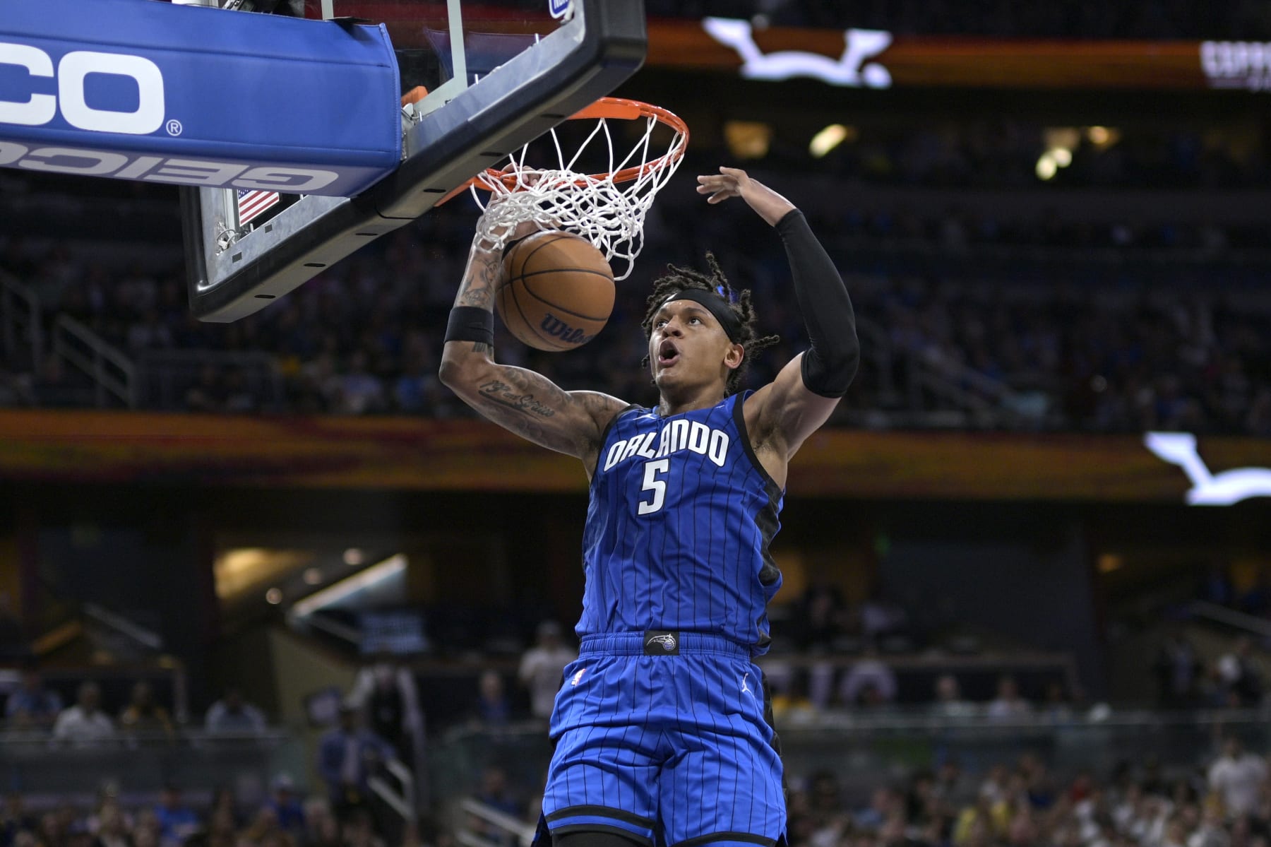 Orlando Magic forward Paolo Banchero (5) dunks during the second half of an NBA basketball game against the Golden State Warriors, Thursday, Nov. 3, 2022, in Orlando, Fla. (AP Photo/Phelan M. Ebenhack)