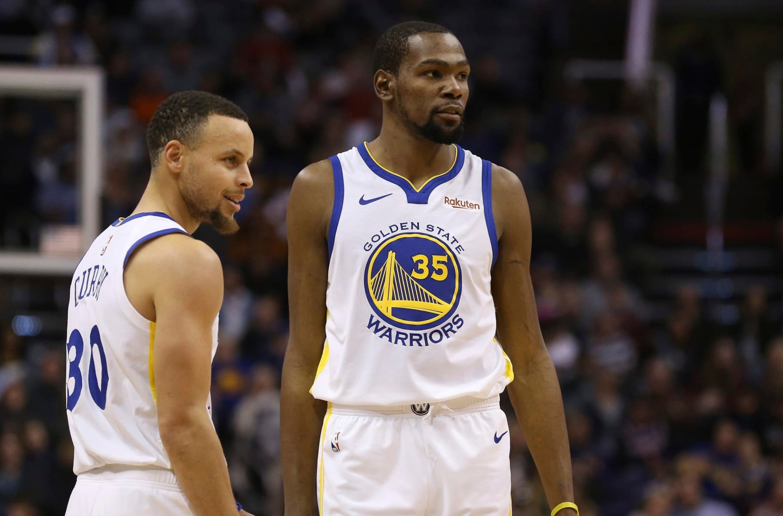 FILE - In this Feb. 8, 2019, file photo, Golden State Warriors guard Stephen Curry (30) and forward Kevin Durant (35) pause during the first half of an NBA basketball game against the Phoenix Suns Friday, Feb. 8, 2019, in Phoenix. Someday, years or even decades from now, at one of those celebratory reunions teams like to do, Stephen Curry knows he and Kevin Durant will reminisce with fondness about their three insanely successful years together on the Golden State Warriors. They will reflect on the greatness, the fun, all they learned from each other shooting side by side day after day to become better from their time as teammates. Two championships, a pair of NBA Finals MVP awards for Durant. (AP Photo/Ross D. Franklin, File) FILE - In this Feb. 8, 2019, file photo, Golden State Warriors guard Stephen Curry (30) and forward Kevin Durant (35) pause during the first half of an NBA basketball game against the Phoenix Suns Friday, Feb. 8, 2019, in Phoenix. Someday, years or even decades from now, at one of those celebratory reunions teams like to do, Stephen Curry knows he and Kevin Durant will reminisce with fondness about their three insanely successful years together on the Golden State Warriors. They will reflect on the greatness, the fun, all they learned from each other shooting side by side day after day to become better from their time as teammates. Two championships, a pair of NBA Finals MVP awards for Durant. (AP Photo/Ross D. Franklin, File)