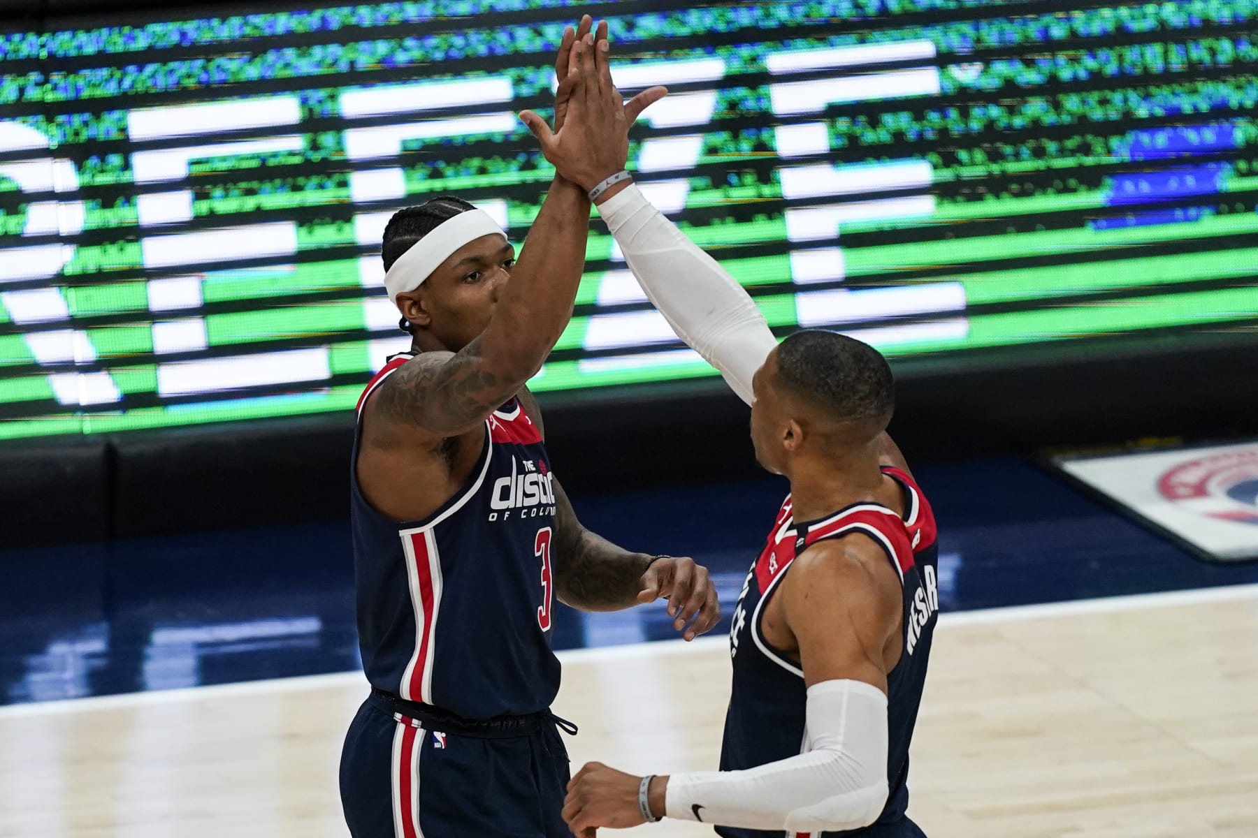 Washington Wizards guard Bradley Beal (3) and Washington Wizards guard Russell Westbrook (4) react after a play during the first half of a basketball game against the Indiana Pacers , Monday, May 3, 2021, in Washington. (AP Photo/Alex Brandon)