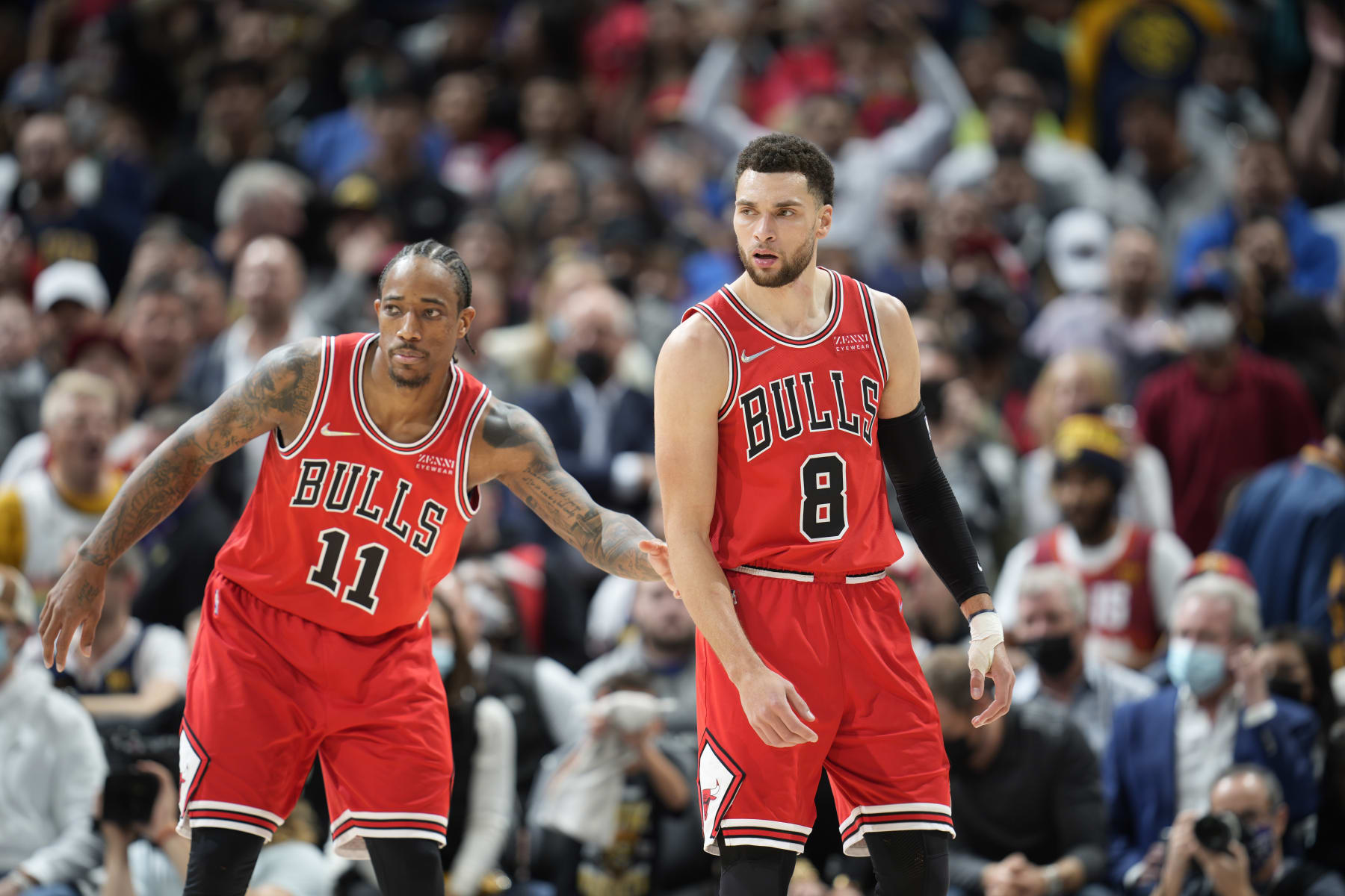 Chicago Bulls forward DeMar DeRozan (11) and Chicago Bulls guard Zach LaVine (8) in the second half of an NBA basketball game Friday, Nov. 19, 2021, in Denver. The Bulls won 114-108. (AP Photo/David Zalubowski)