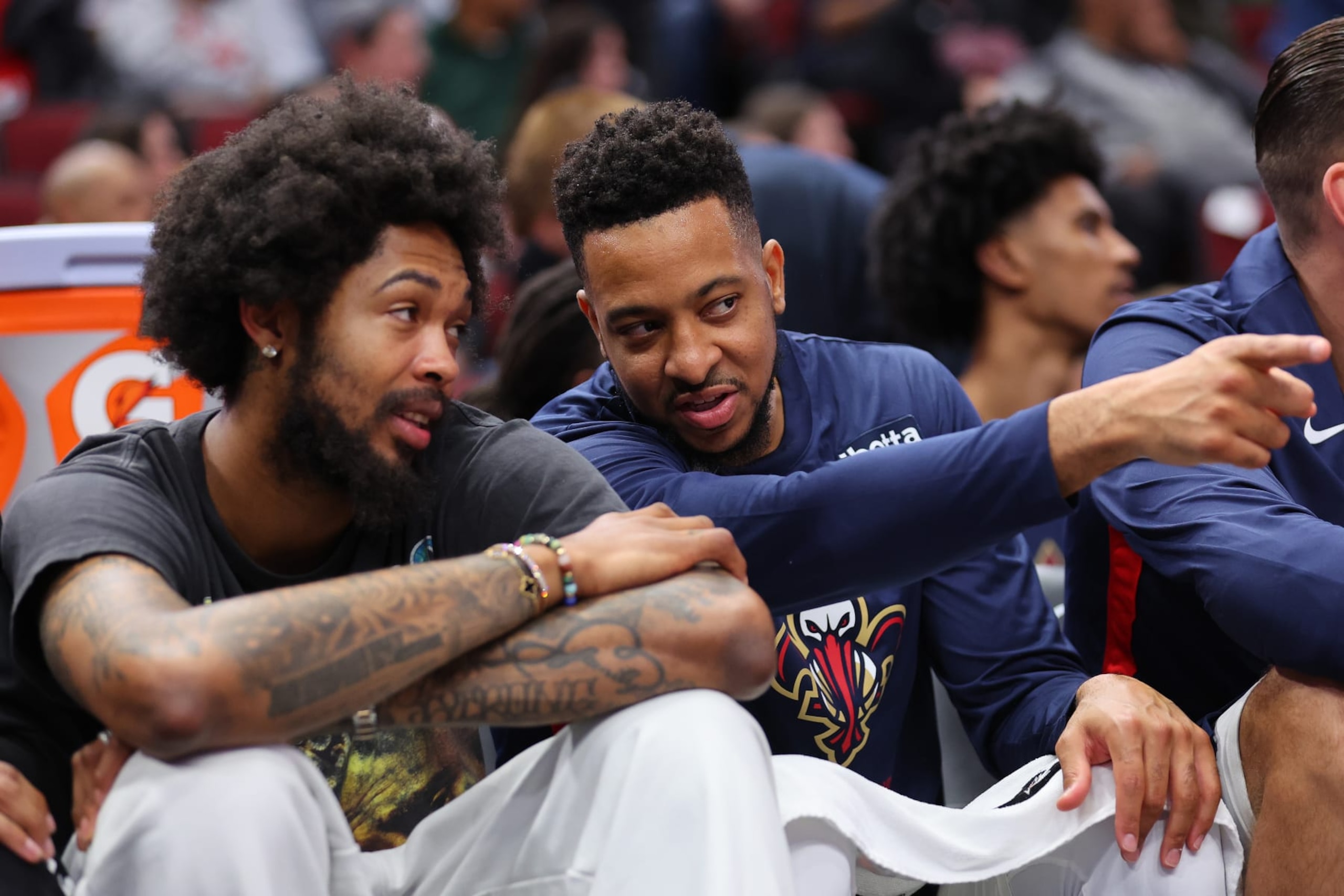 CHICAGO, ILLINOIS - OCTOBER 04: Brandon Ingram #14 and CJ McCollum #3 of the New Orleans Pelicans talk on the bench against the Chicago Bulls during the first half of a preseason game at the United Center on October 04, 2022 in Chicago, Illinois.NOTE TO USER: User expressly acknowledges and agrees that, by downloading and or using this photograph, User is consenting to the terms and conditions of the Getty Images License Agreement. (Photo by Michael Reaves/Getty Images) CHICAGO, ILLINOIS - OCTOBER 04: Brandon Ingram #14 and CJ McCollum #3 of the New Orleans Pelicans talk on the bench against the Chicago Bulls during the first half of a preseason game at the United Center on October 04, 2022 in Chicago, Illinois.NOTE TO USER: User expressly acknowledges and agrees that, by downloading and or using this photograph, User is consenting to the terms and conditions of the Getty Images License Agreement. (Photo by Michael Reaves/Getty Images)