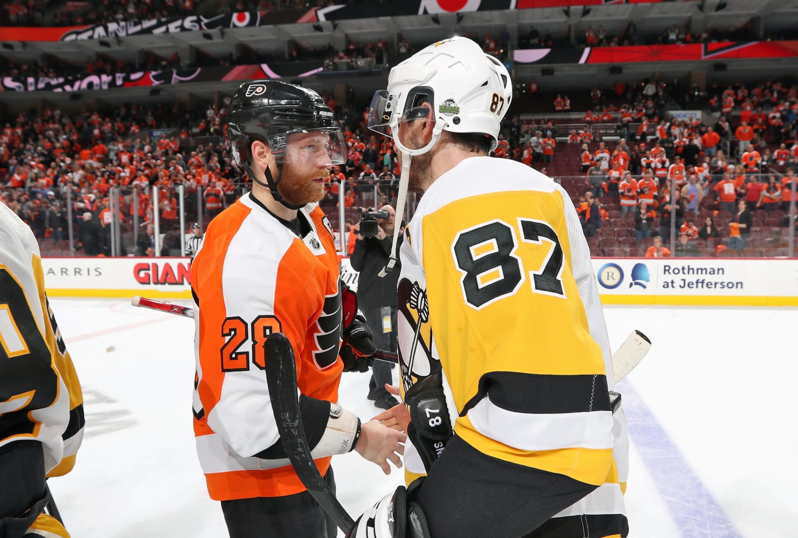 PHILADELPHIA, PA - APRIL 22: Claude Giroux #28 of the Philadelphia Flyers shakes hands with Sidney Crosby #87 of the Pittsburgh Penguins after the Penguins defeated the Flyers 8-5 in Game Six of the Eastern Conference First Round during the 2018 NHL Stanley Cup Playoffs at the Wells Fargo Center on April 22, 2018 in Philadelphia, Pennsylvania. The Penguins advanced to the Second Round of the 2018 NHL Stanley Cup Playoffs with today's victory. (Photo by Len Redkoles/NHLI via Getty Images) PHILADELPHIA, PA - APRIL 22: Claude Giroux #28 of the Philadelphia Flyers shakes hands with Sidney Crosby #87 of the Pittsburgh Penguins after the Penguins defeated the Flyers 8-5 in Game Six of the Eastern Conference First Round during the 2018 NHL Stanley Cup Playoffs at the Wells Fargo Center on April 22, 2018 in Philadelphia, Pennsylvania. The Penguins advanced to the Second Round of the 2018 NHL Stanley Cup Playoffs with today's victory. (Photo by Len Redkoles/NHLI via Getty Images)