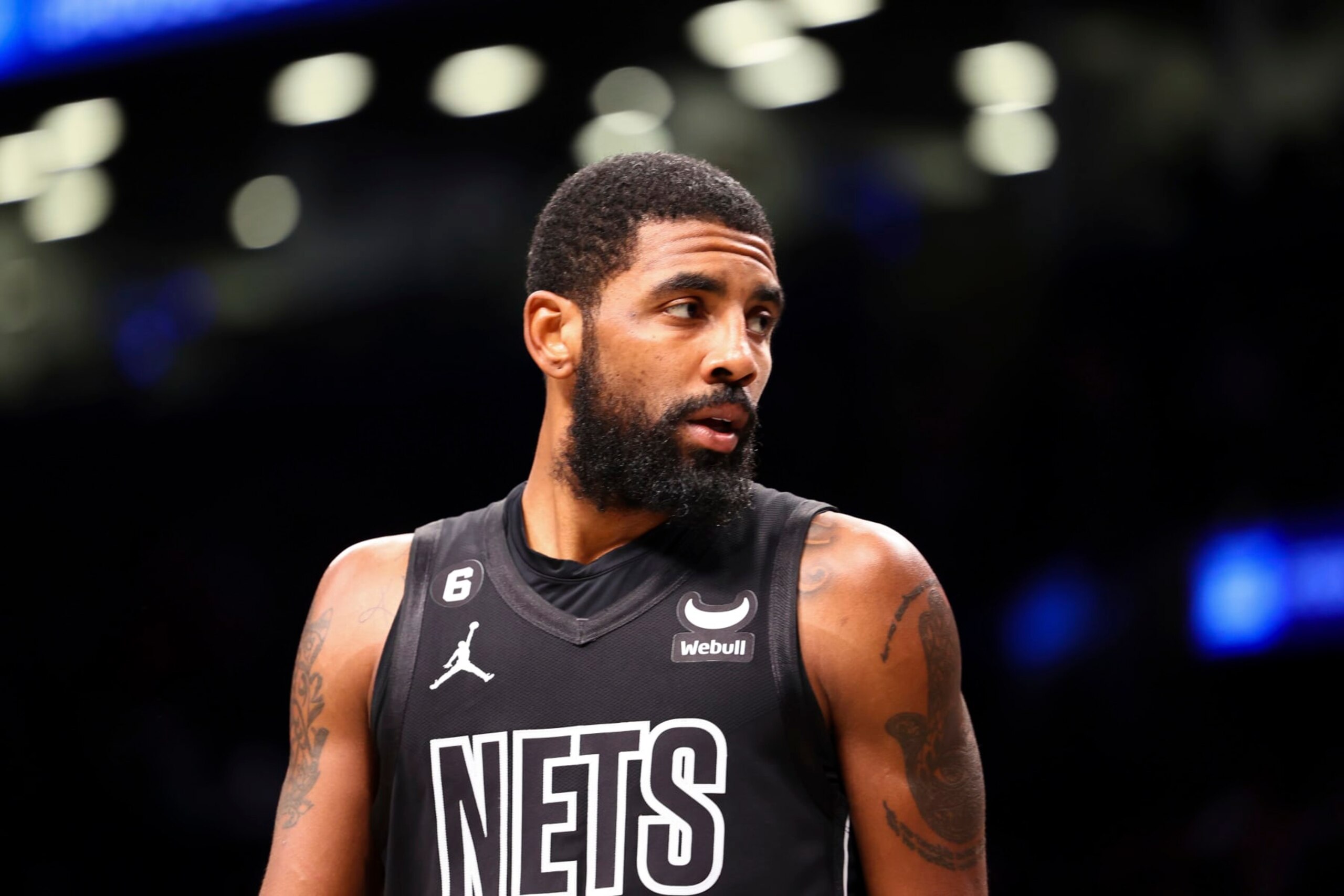 Brooklyn Nets guard Kyrie Irving looks out during the first half of an NBA basketball game against the Indiana Pacers Monday, Oct. 31, 2022, in New York. (AP Photo/Jessie Alcheh)